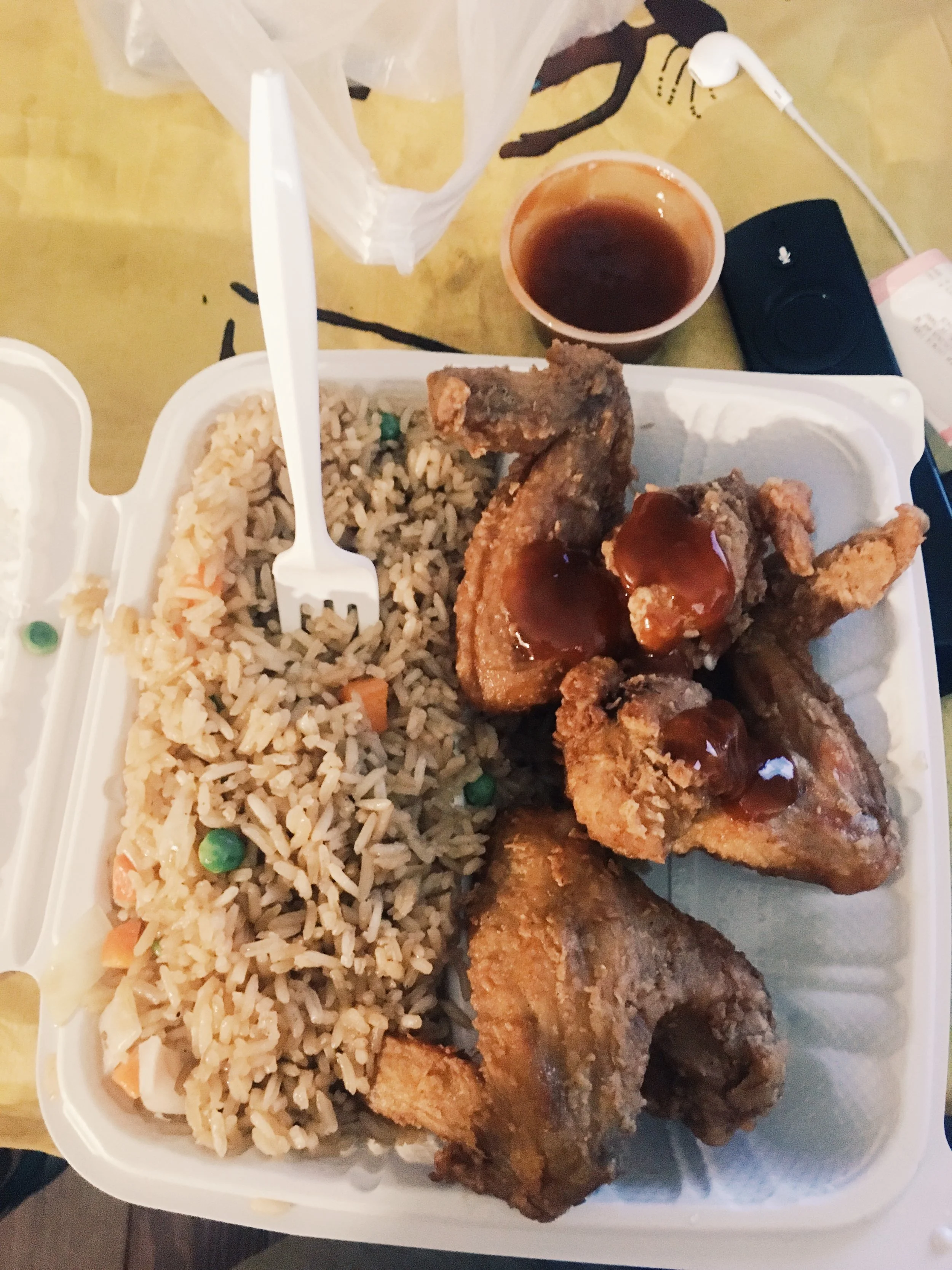 Chicken wing w/ Mumbo Sauce and fried rice from the D.C. curry out. (moe)