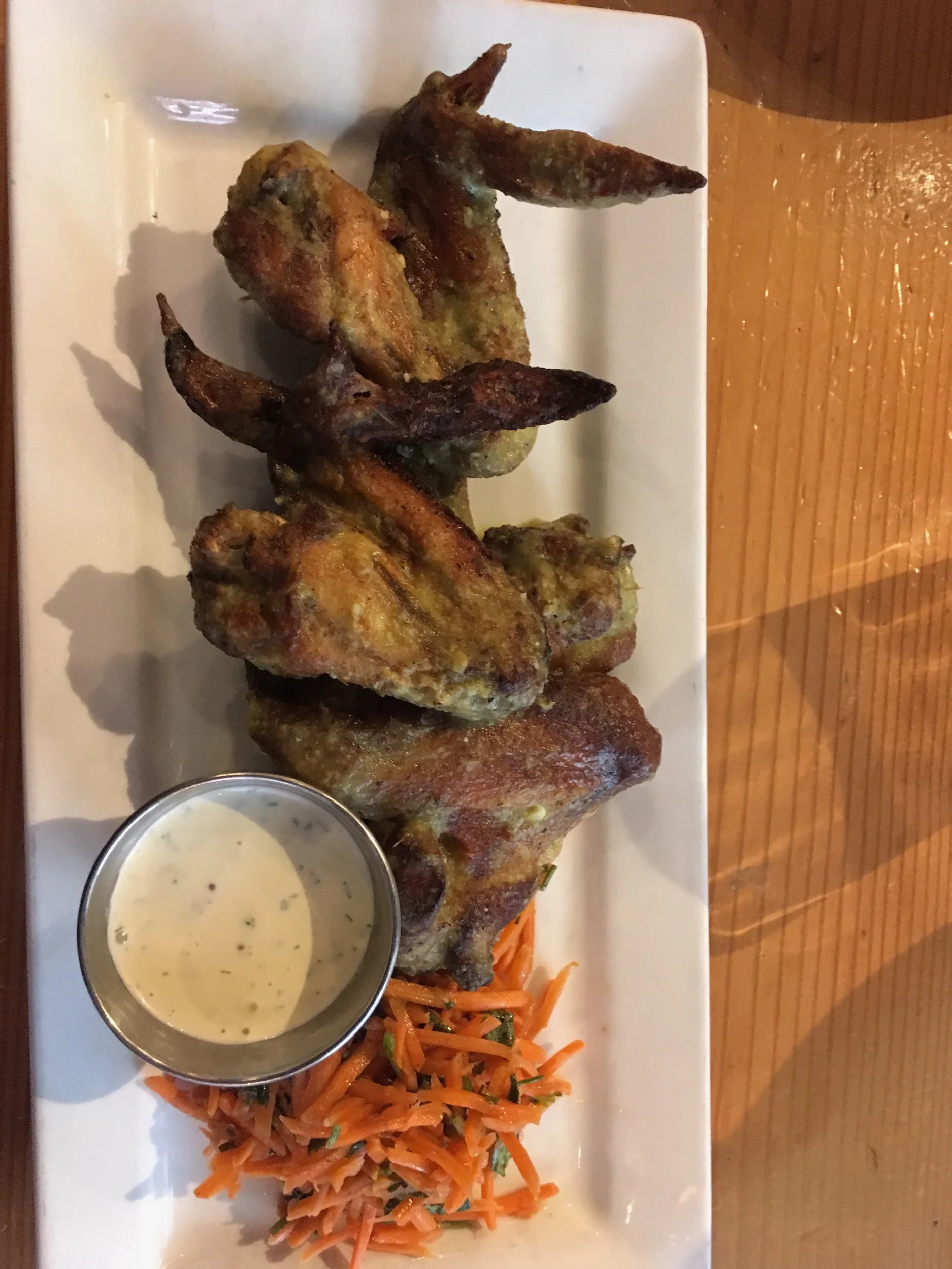 Smoked Chicken Wing Roasted jalapeño sauce, carrot salad, buttermilk ranch.. A really good smoky taste, and the jalapeño sauce gave it a nice tangy accent. 7.5/10…. the flavor was powerful in a good way, but the chicken could have had more of a cris…