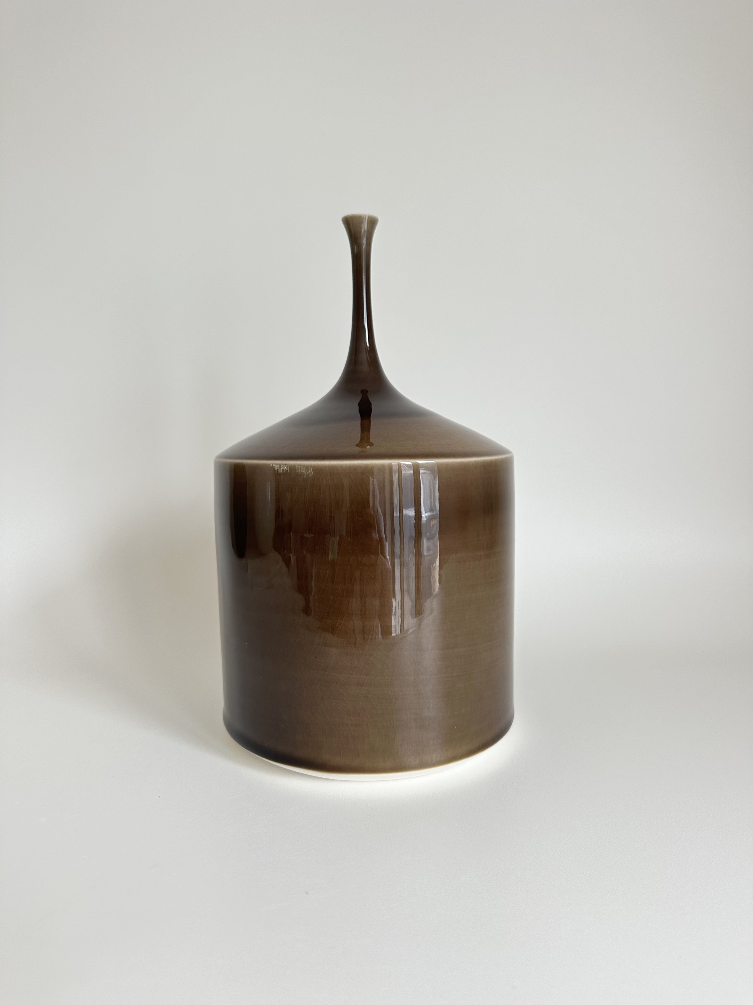 small wide bottle shiny brown