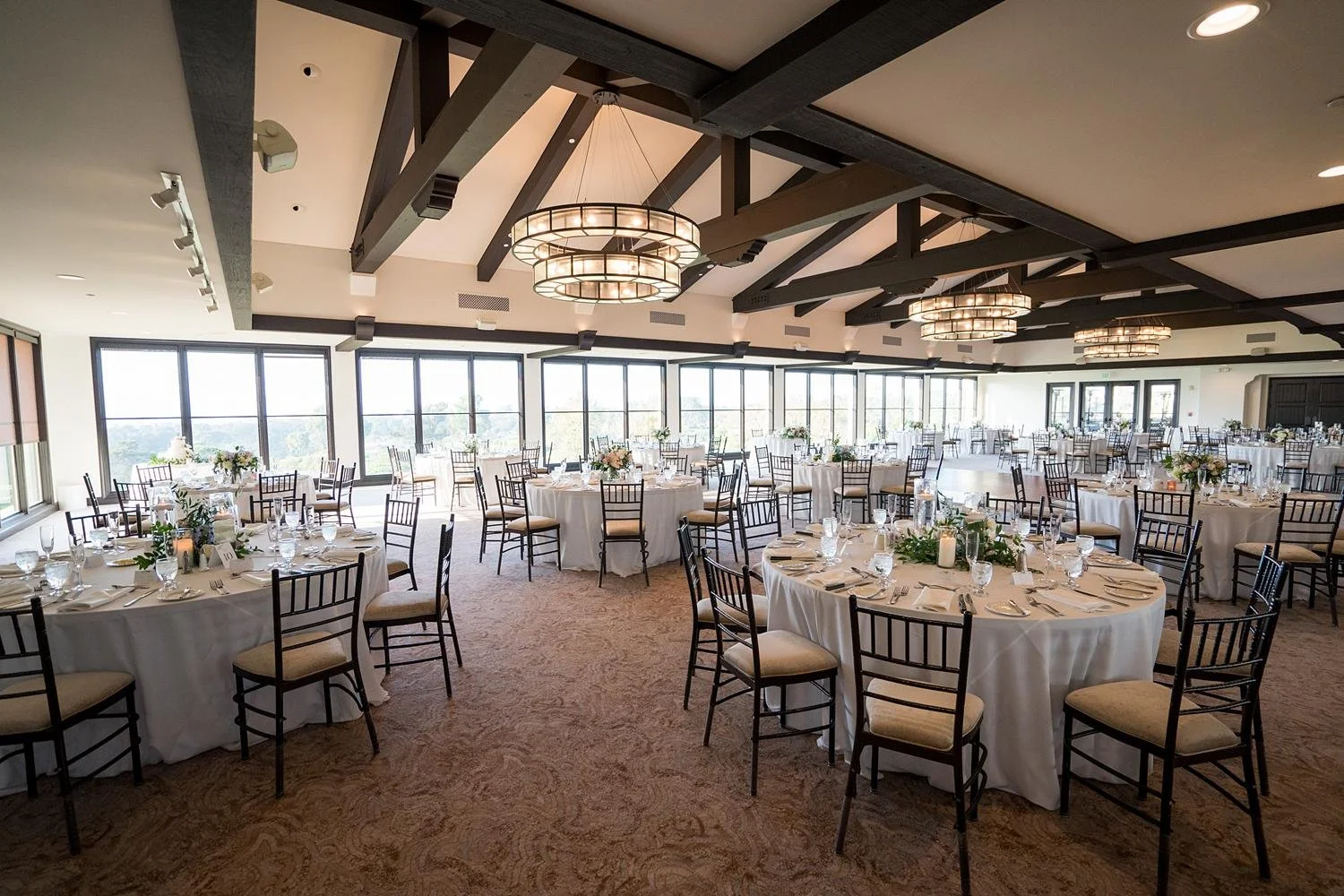 Wedding reception with candlelit centerpieces creating a romantic glow at Palos Verdes Golf Club