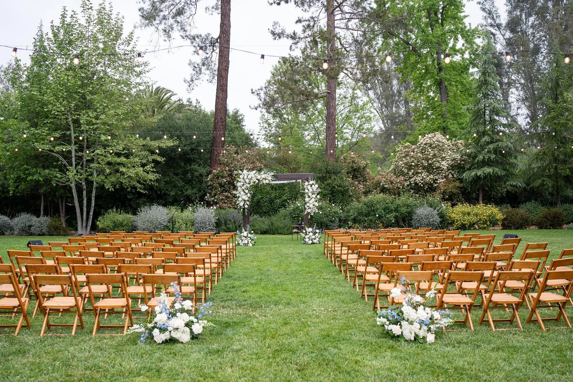 Jewish wedding ceremony on the lawn at the Lodge at Malibou Lake set beneath trees