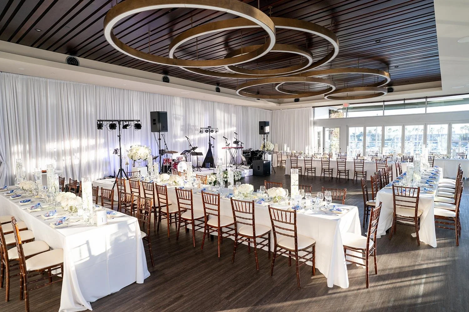 Horizon Level wedding reception at Shade Hotel Redondo Beach with banquet tables, rose centerpieces and candlelight