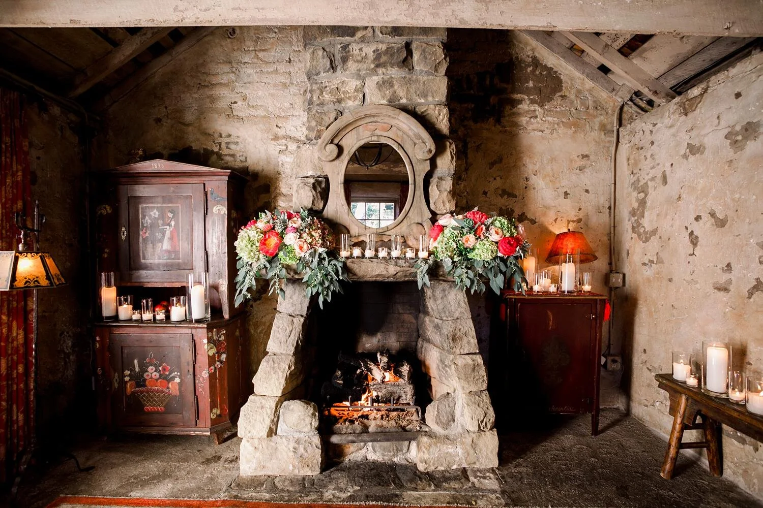 Intimate wedding ceremony in front of fireplace with candles at Old Adobe, San Ysidro Ranch