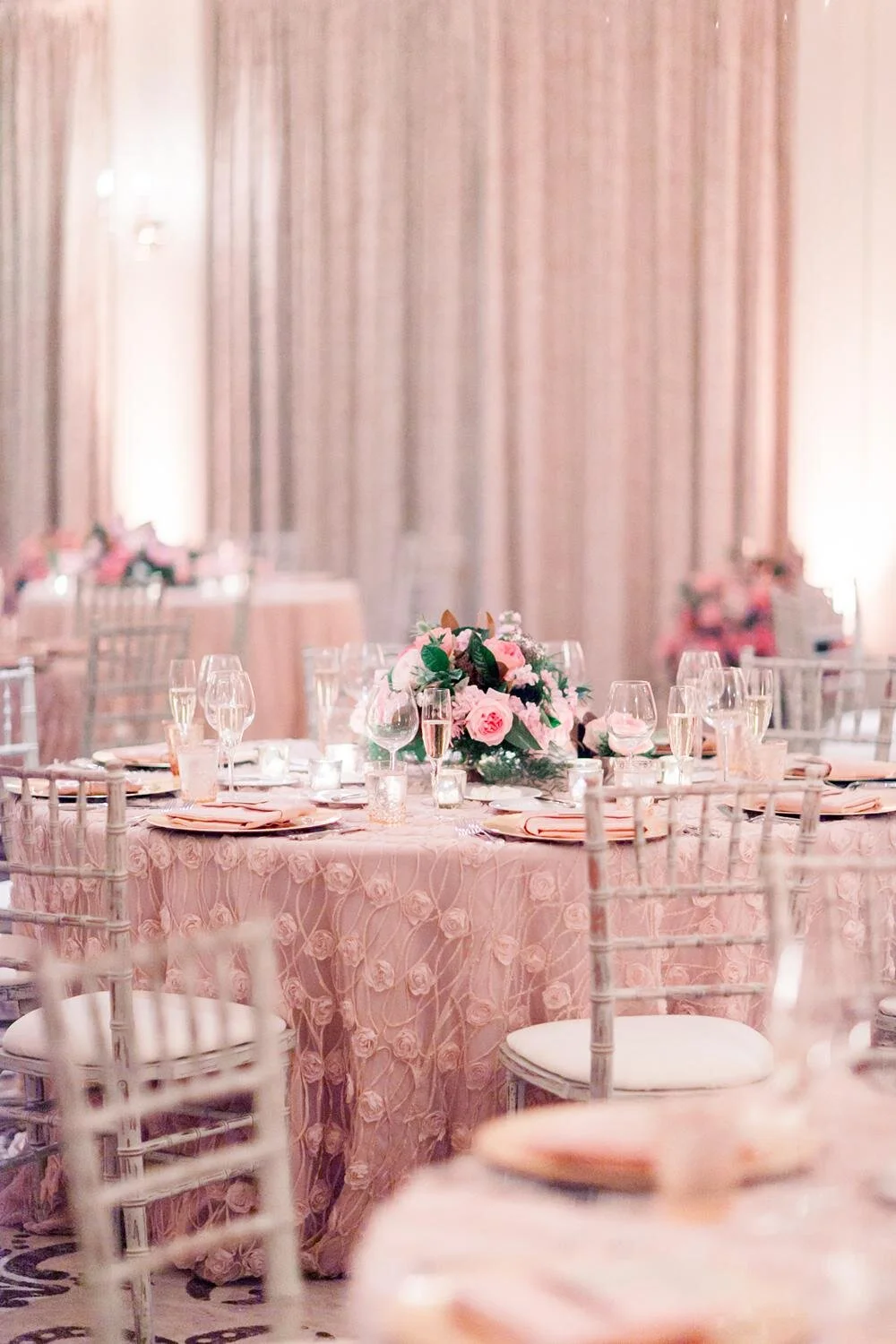 Detail of floral centerpieces for Riverside Ballroom wedding reception at Belmond El Encanto with window views