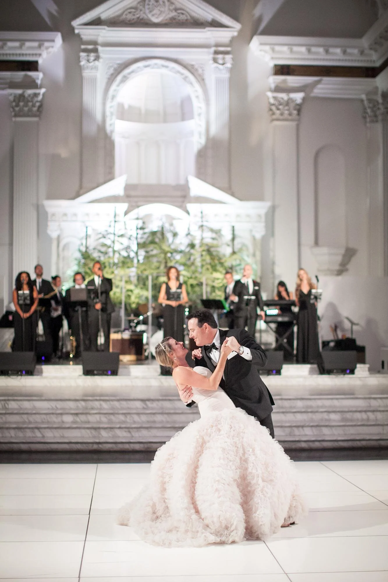 Bride and groom dipping on the dance floor during first dance at Vibiana in Los Angeles