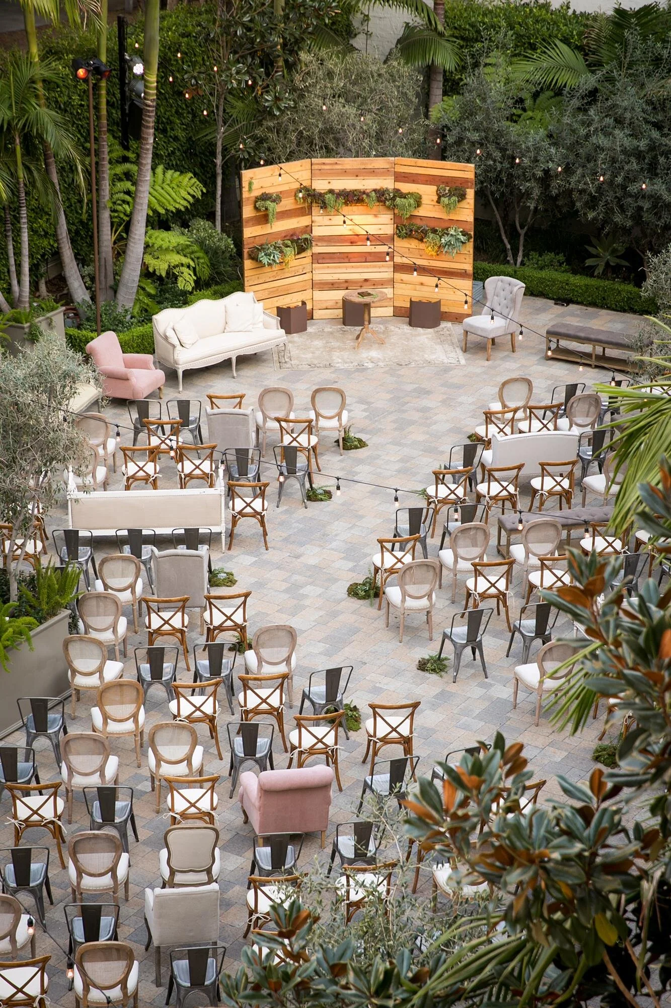 Overhead view of a wedding ceremony in the courtyard during the afternoon at Vibiana in Los Angeles