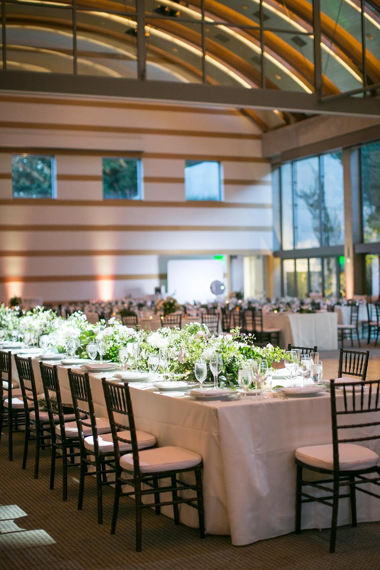 Elegant floral arrangements displayed during a wedding reception in Guerin Ballroom at the Skirball Cultural Center
