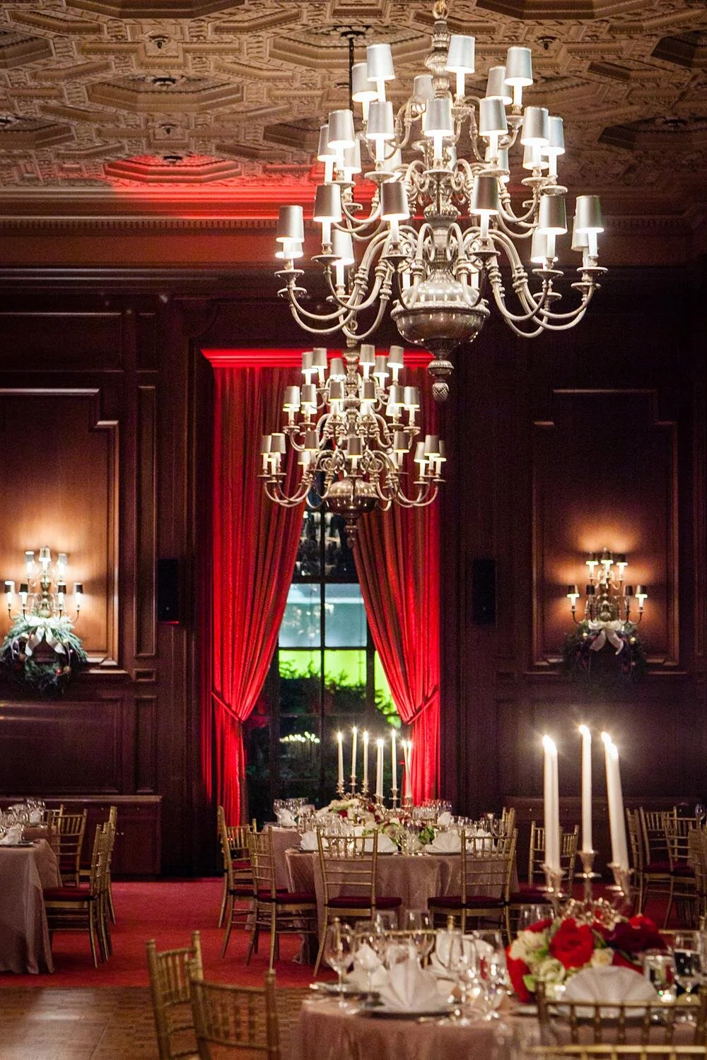 Wedding reception table with candelabras and red roses in the Main Dining Room at the California Club