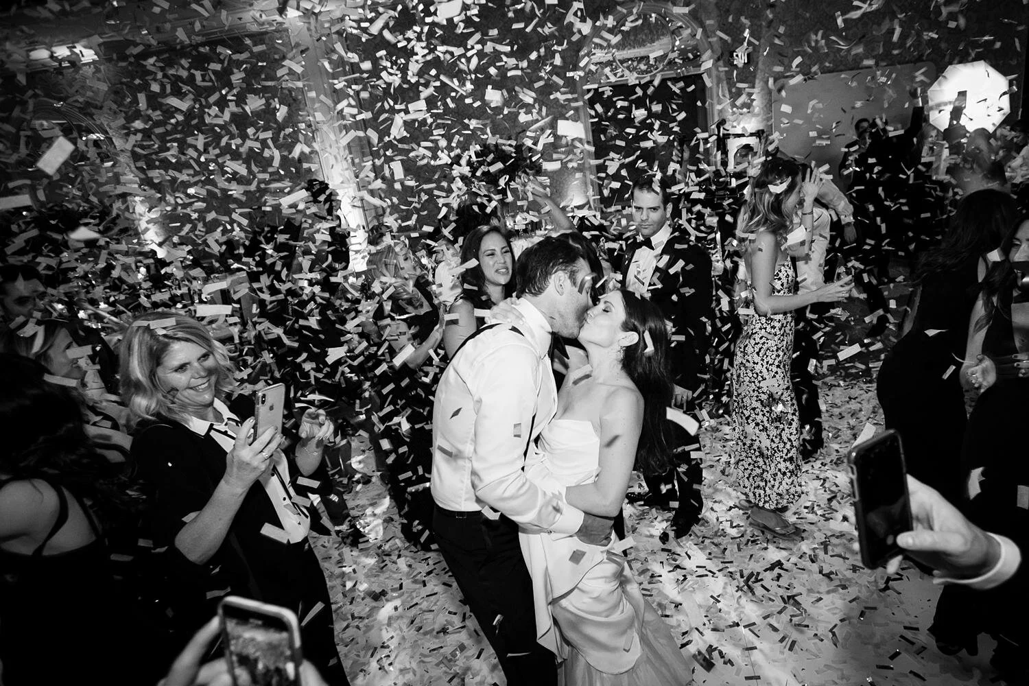 Couple dancing under falling confetti at a ballroom wedding reception at the Four Seasons Los Angeles