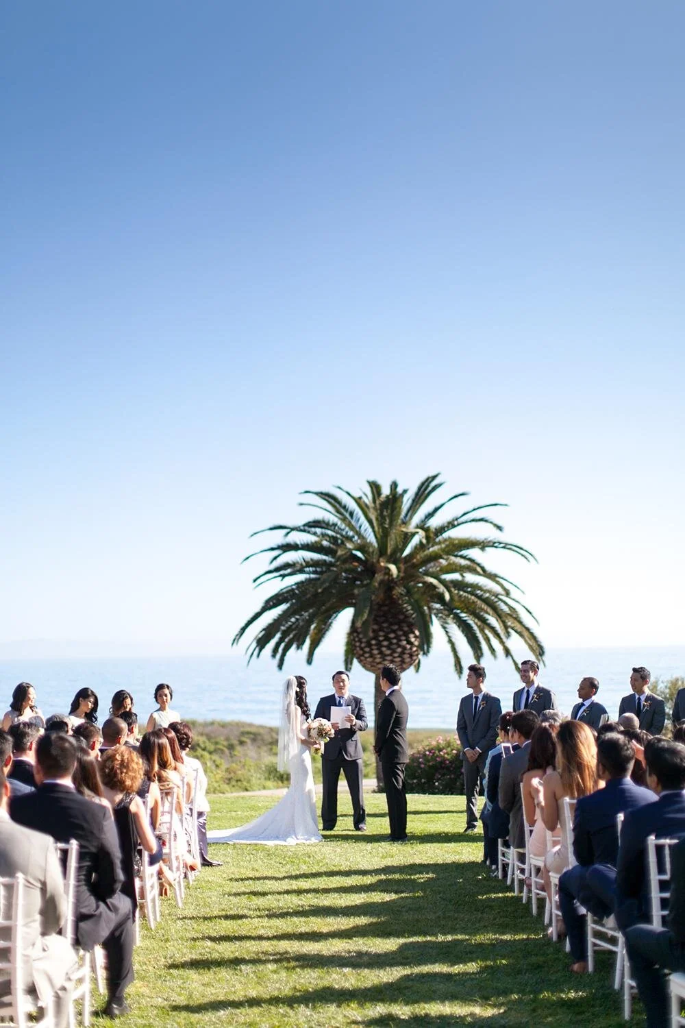 Wedding ceremony overlooking the coastline on the Ocean View Lawn at Ritz Carlton Bacara