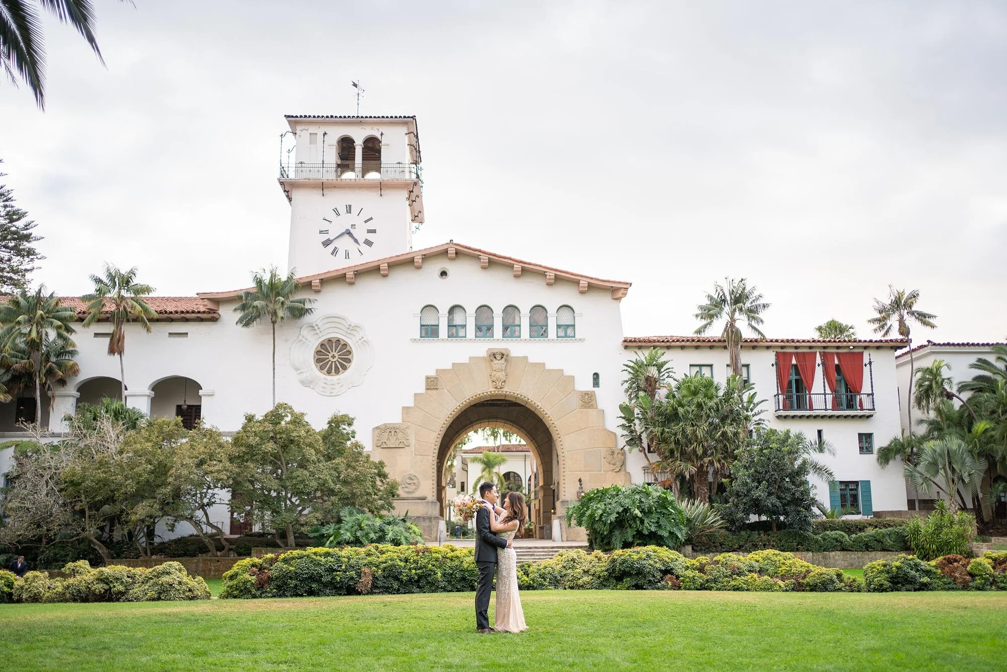 Wedding portrait of bride and groom on the lawn at the Santa Barbara Courthouse