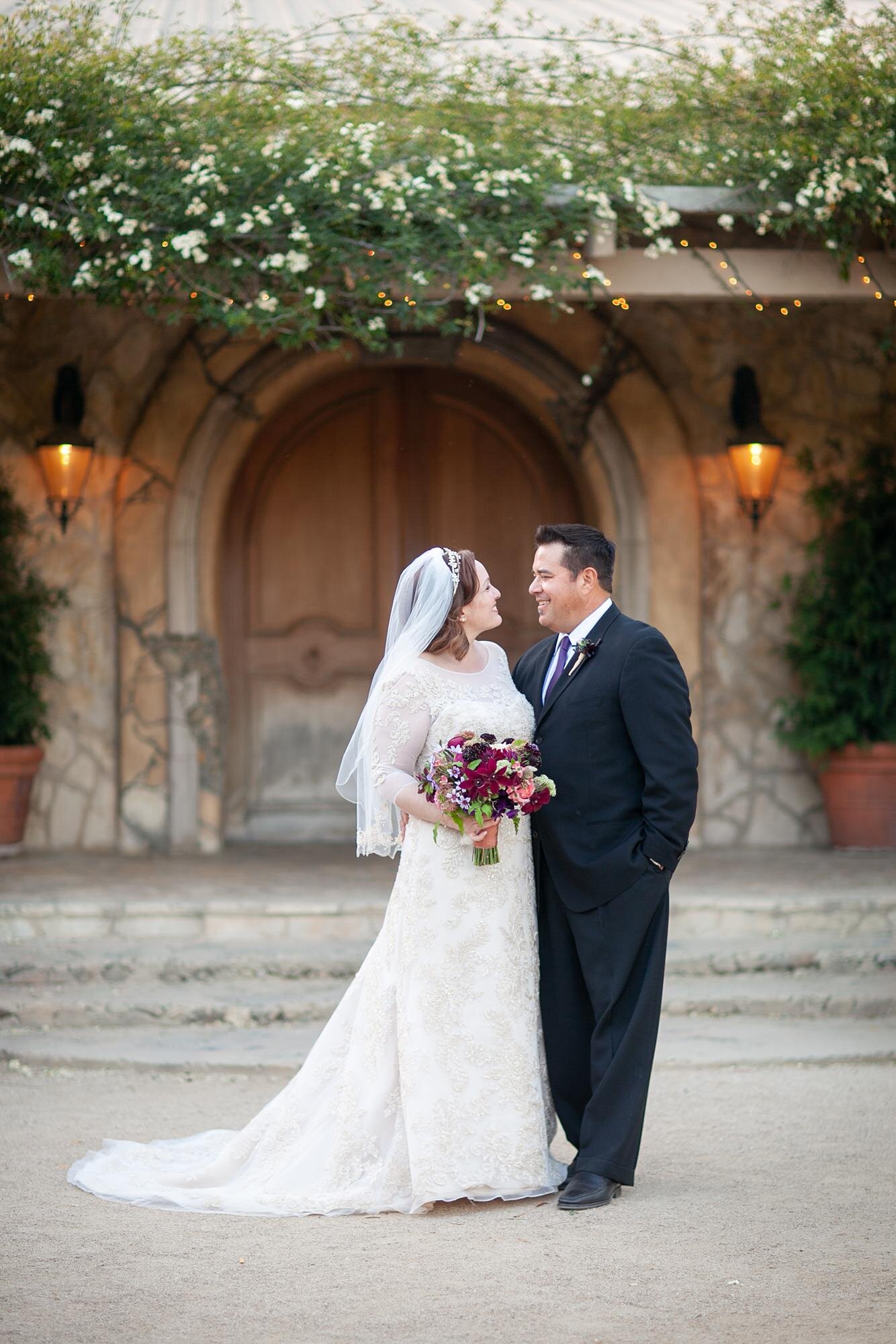Wedding portraits at Sunstone Winery and Villa of bride and groom in the courtyard