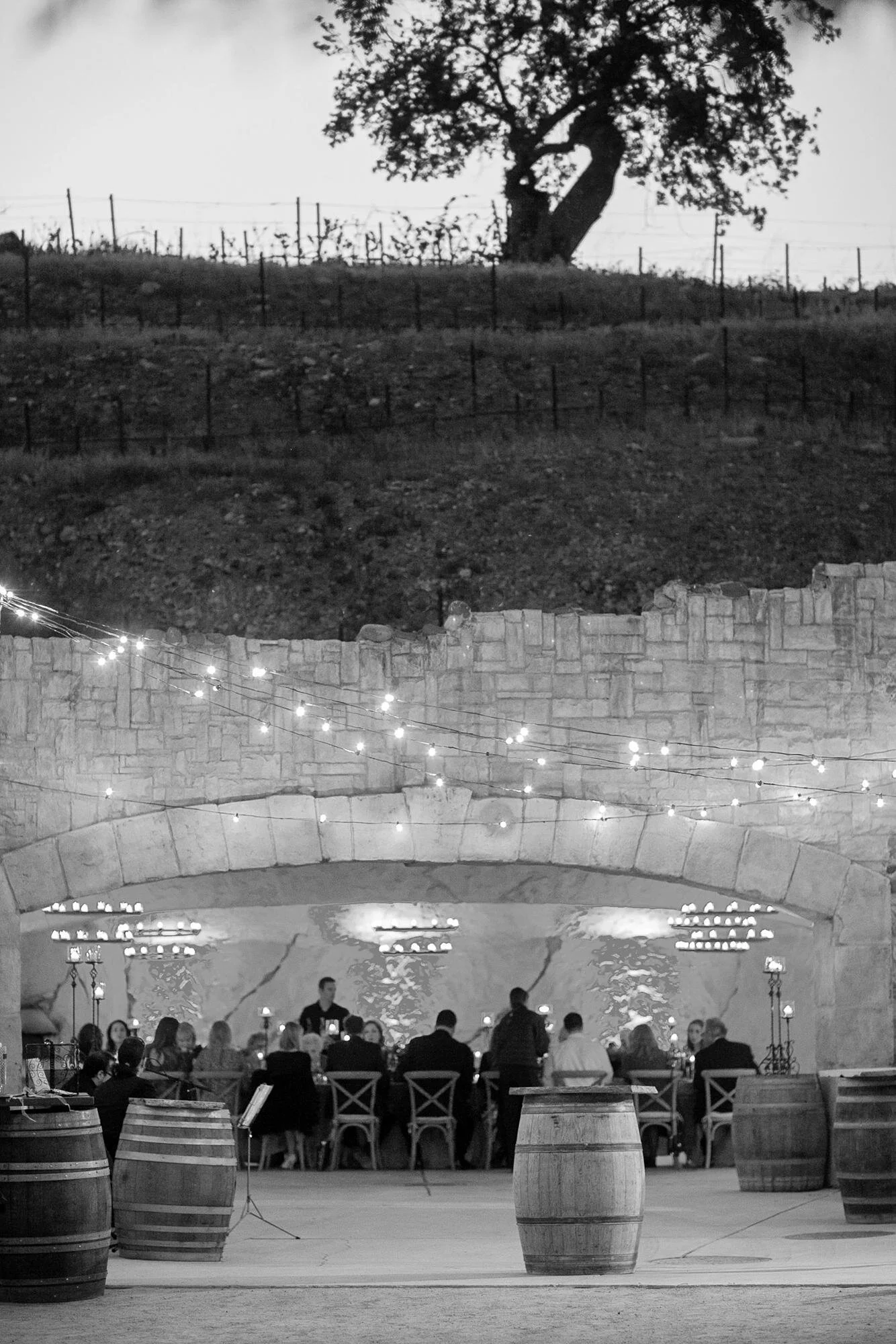 Wedding reception at Sunstone Winery and Villa in the wine cave with guests dining