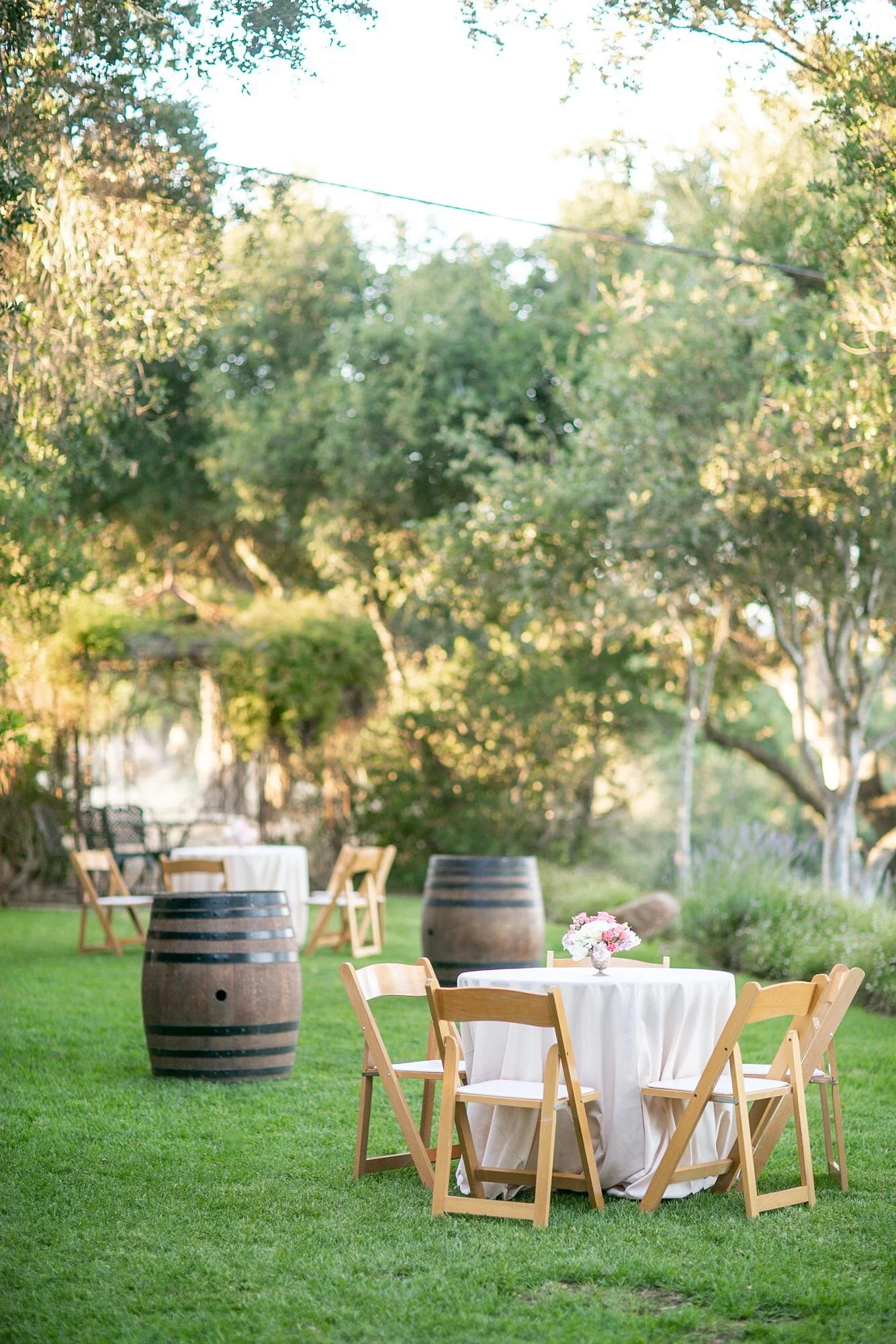 Wedding cocktails at Firestone Winery on the Terrace with wine barrels and standing tables
