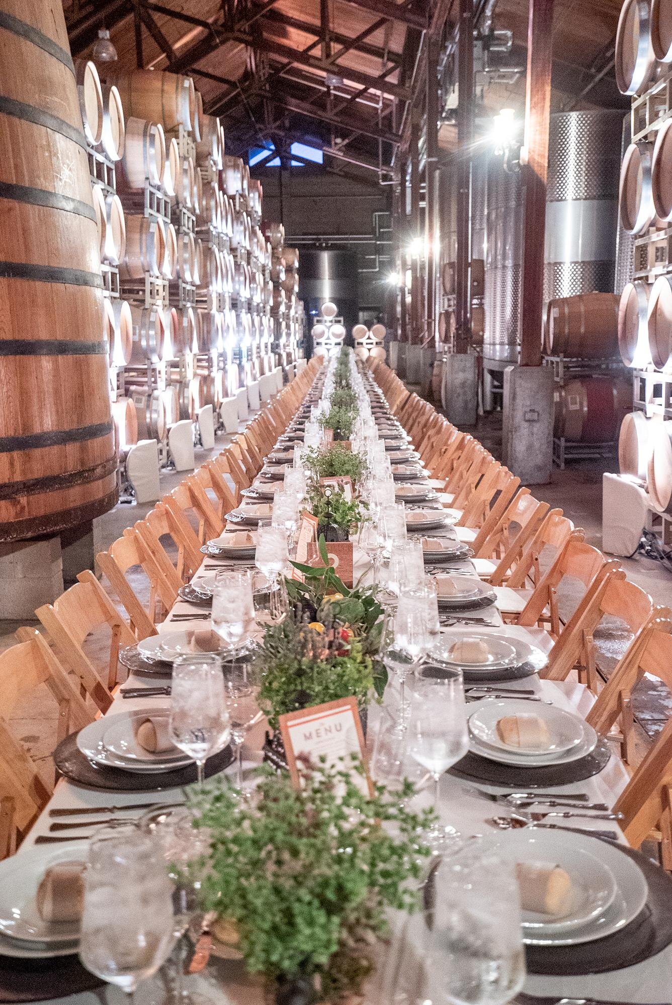 Wedding reception at Firestone Winery featuring a beautifully styled banquet table in the Barrel Room