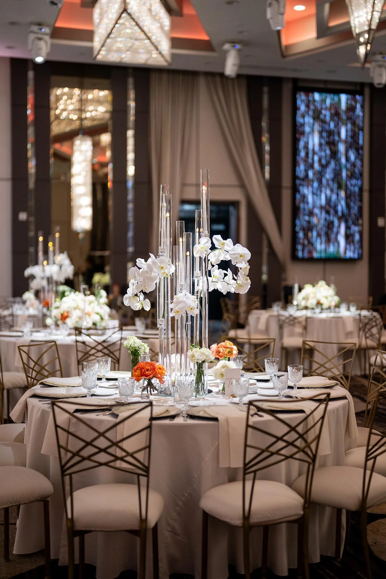 Wedding reception at Landmark Mission Hills with round table, orchids and tall candles