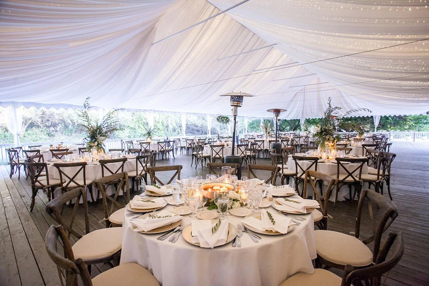 Wedding reception at Calamigos Ranch Pavilion with draped fabric and glowing string lights