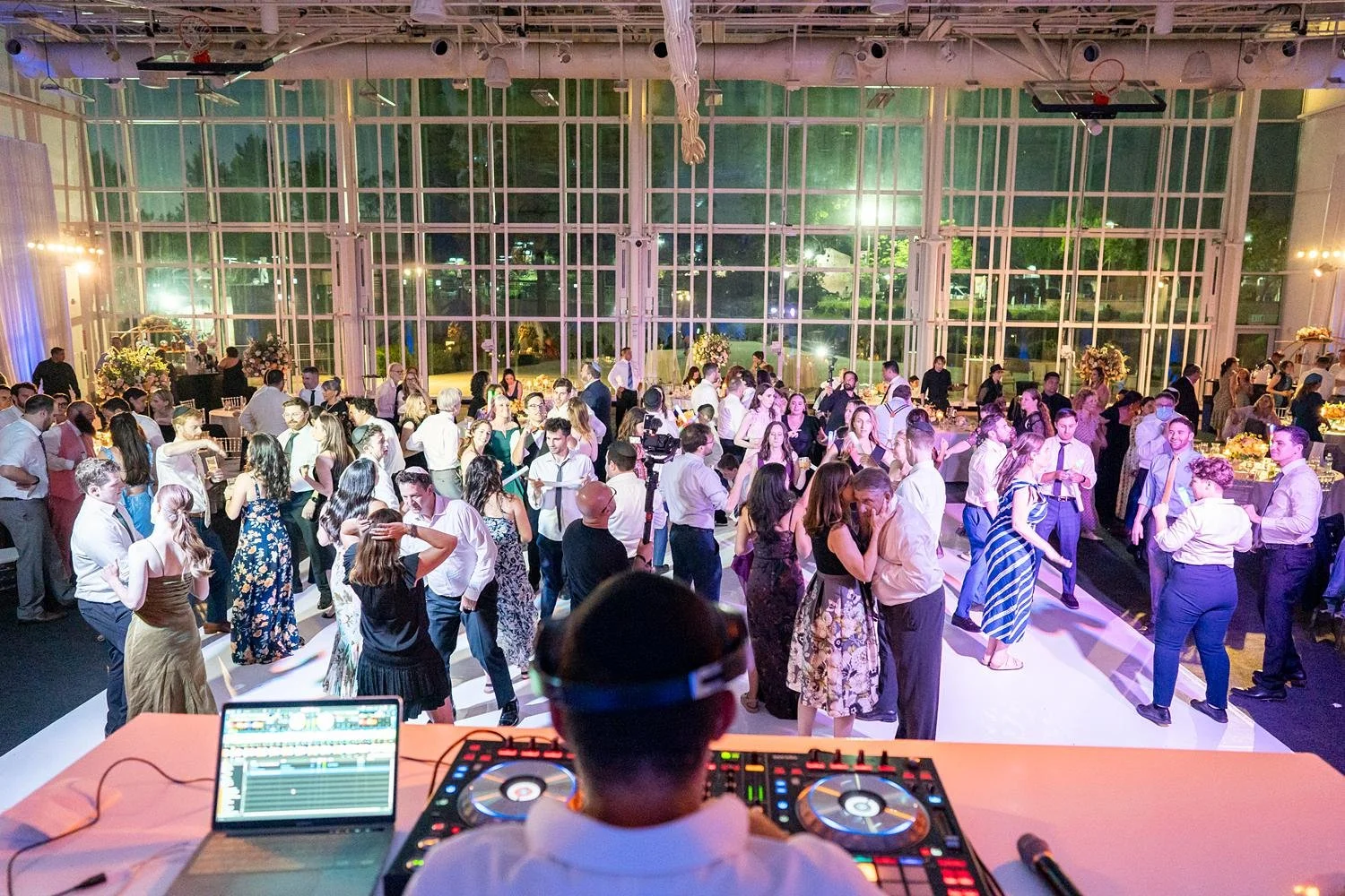 Wedding reception guests dancing on the floor at Stephen Wise Temple