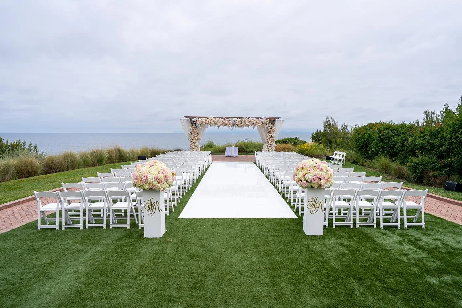 Catalina Point wedding ceremony with pastel wild flowers and ocean views at Terranea Resort