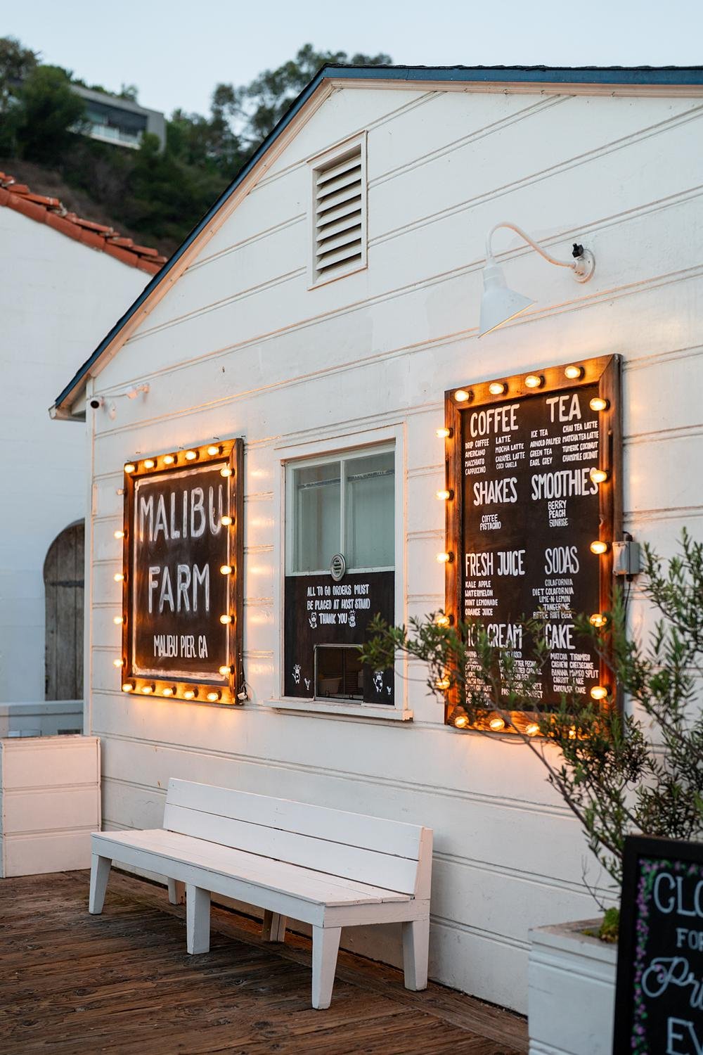 Wedding reception at Malibu Farm at the Pier showing restaurant sign and menu details