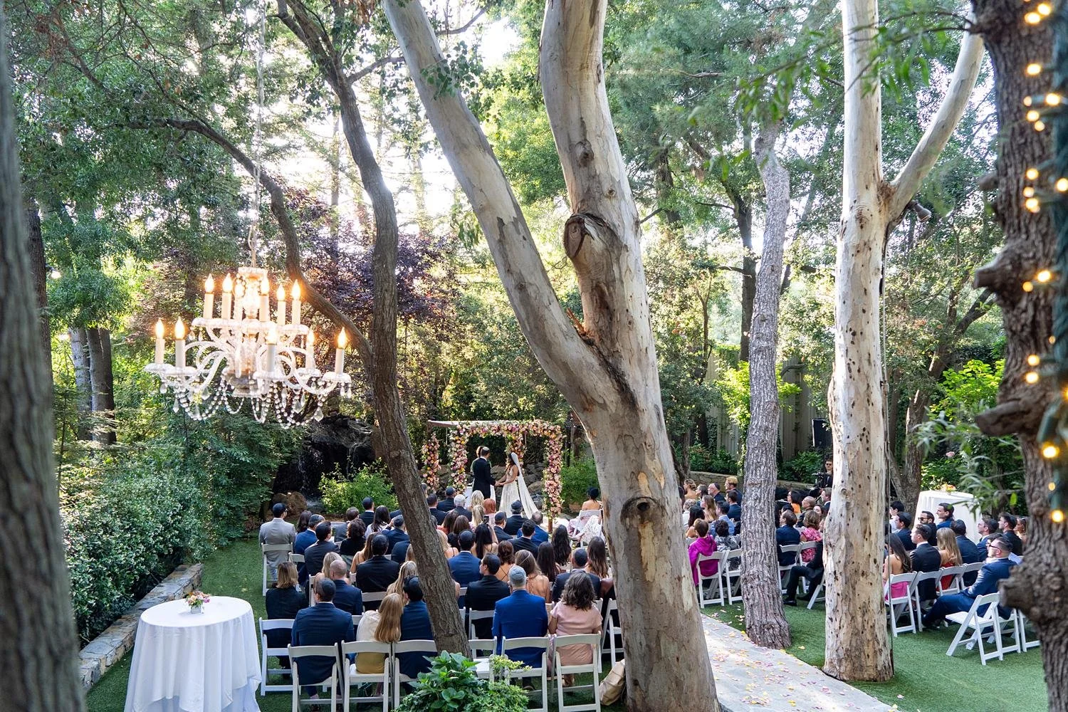 Wedding ceremony at Calamigos Ranch Birchwood with a chuppah covered in roses
