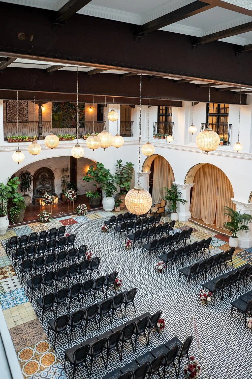 Wedding ceremony seen from the balcony overlooking the courtyard at the Ebell of Long Beach