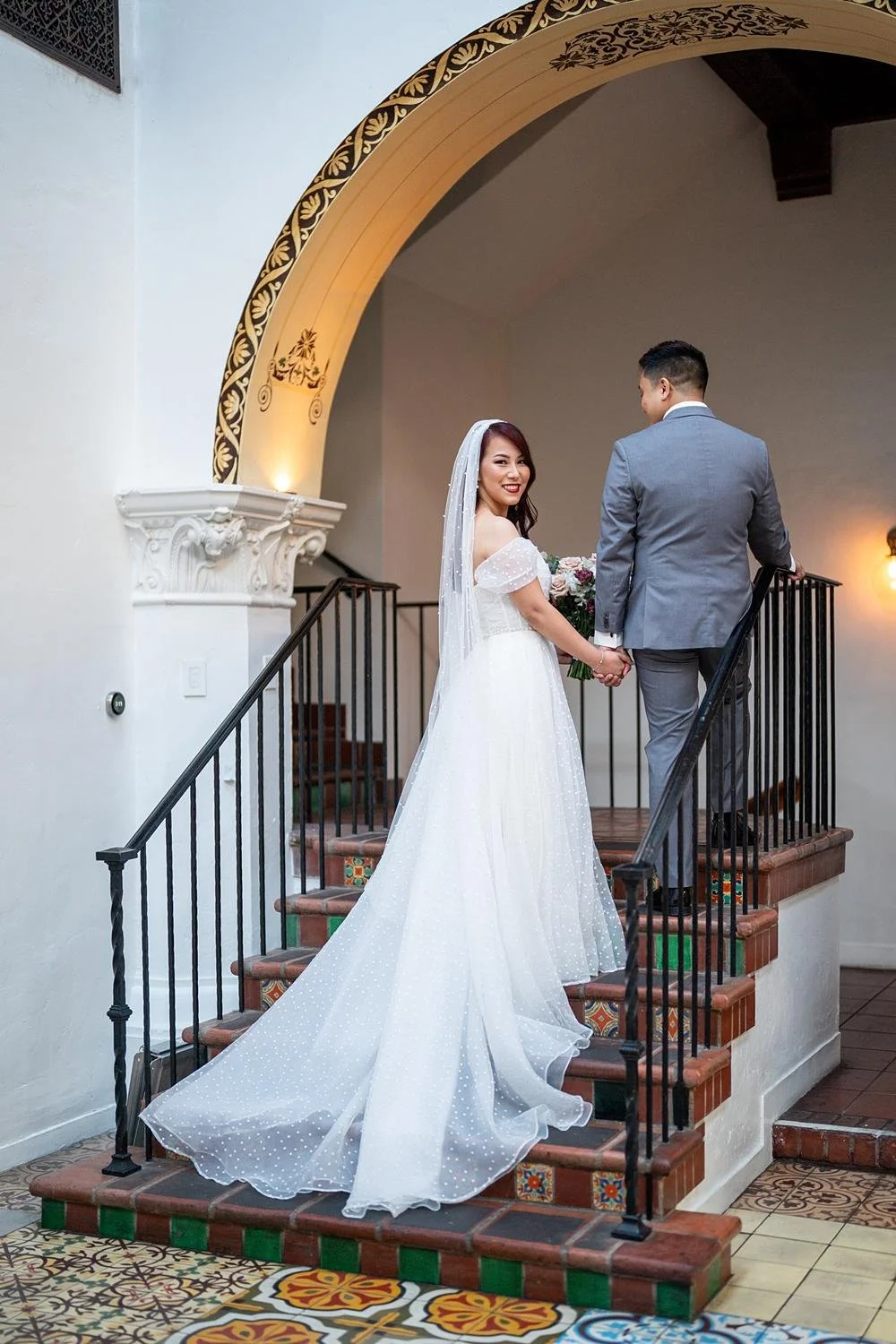wedding-portraits-entrance-stairs-arch-walking