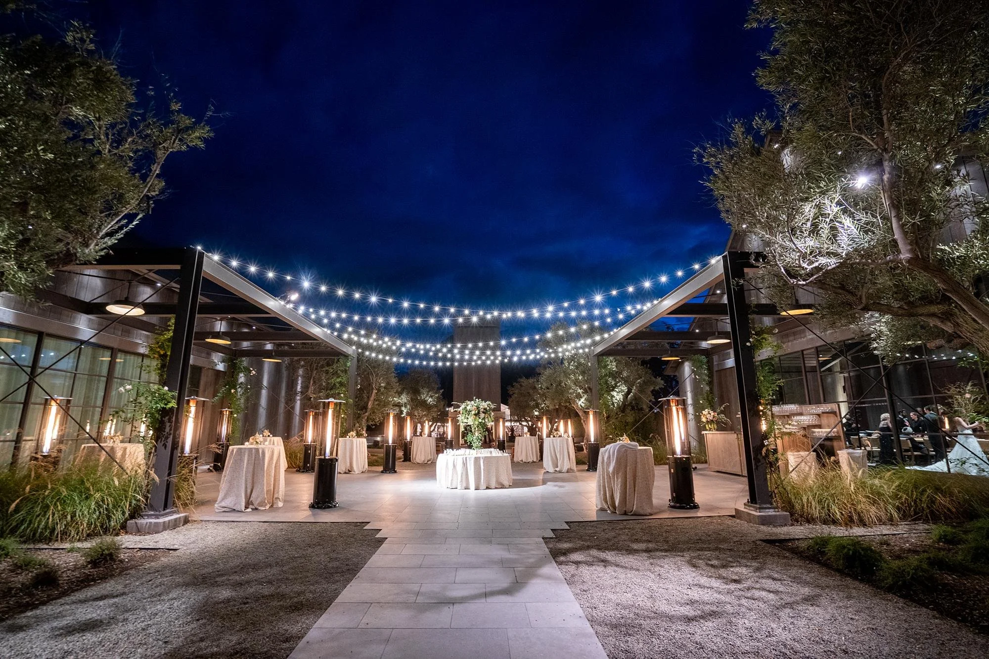 Wedding cocktails at the Farmhouse at Ojai Valley Inn and Spa with evening lighting and hanging lights