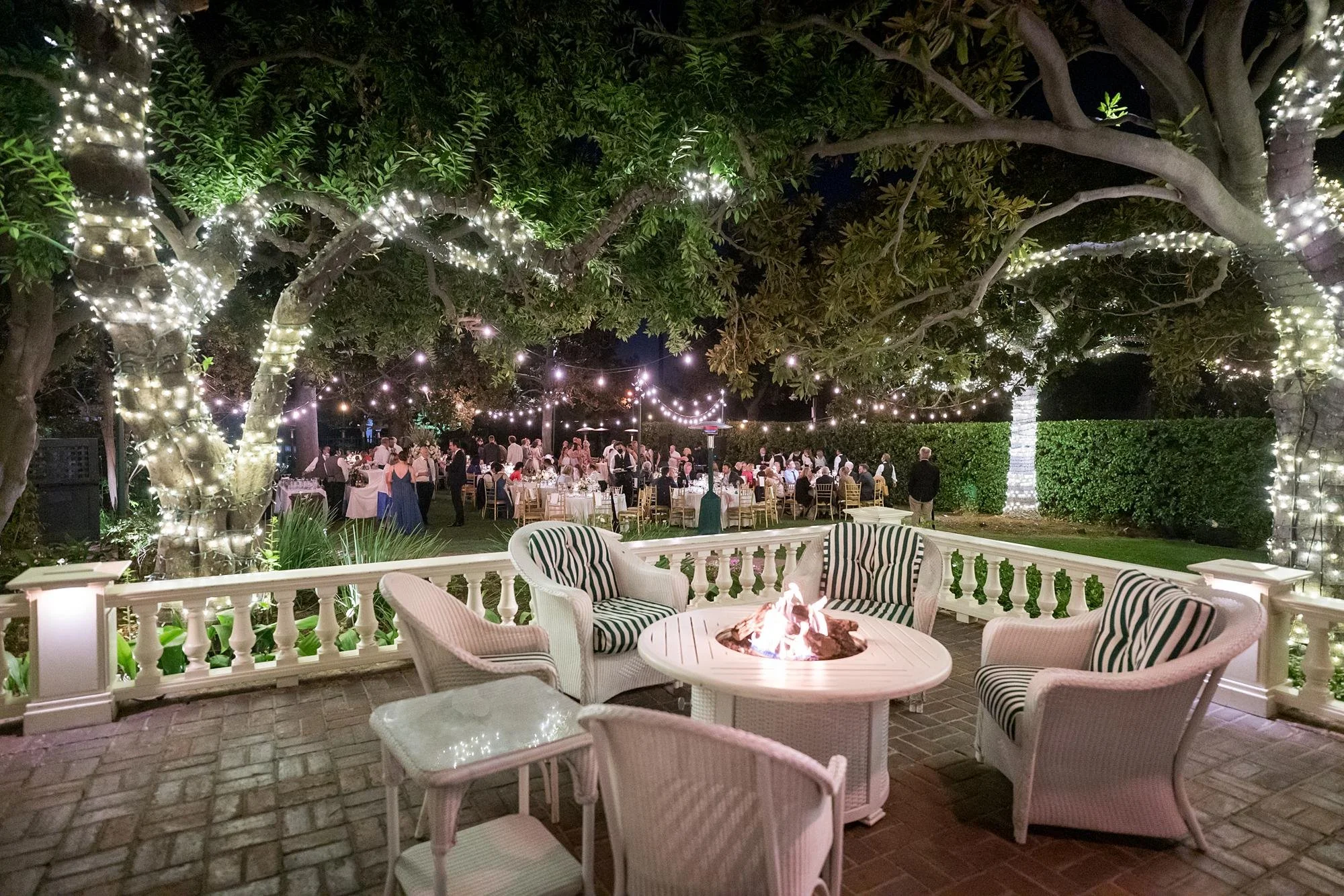 Wedding reception under string lights on the Front Lawn at the Valley Hunt Club