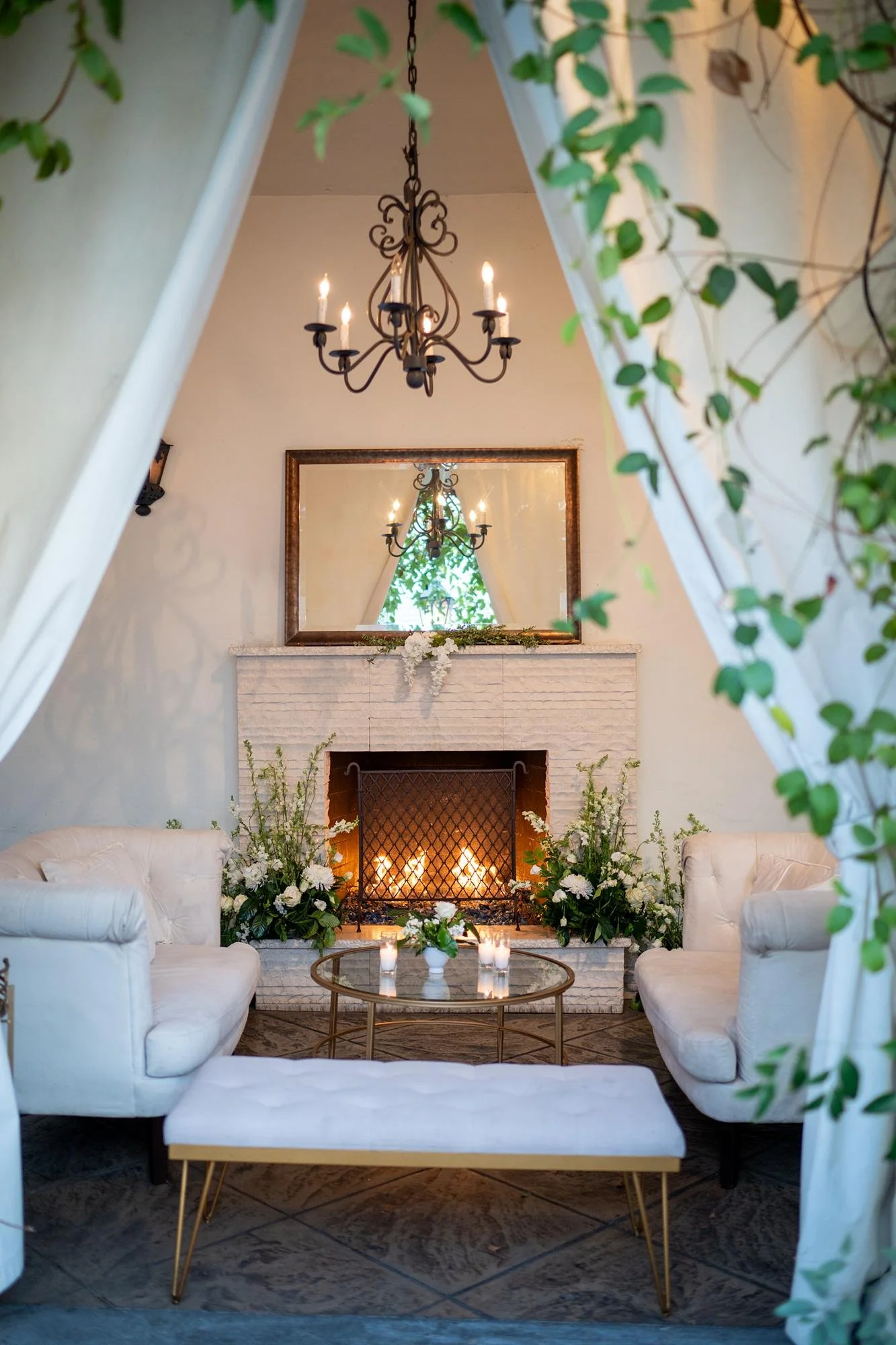 Wedding reception at Villa and Vine with seating area arranged before fireplace