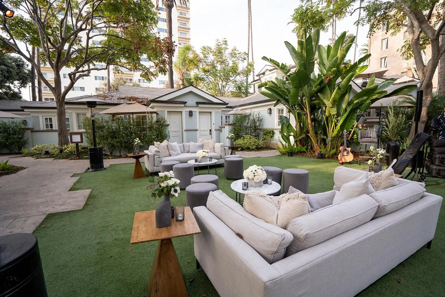 Wide view of wedding cocktail hour with lounge seating in Miramar Gardens at Fairmont Miramar
