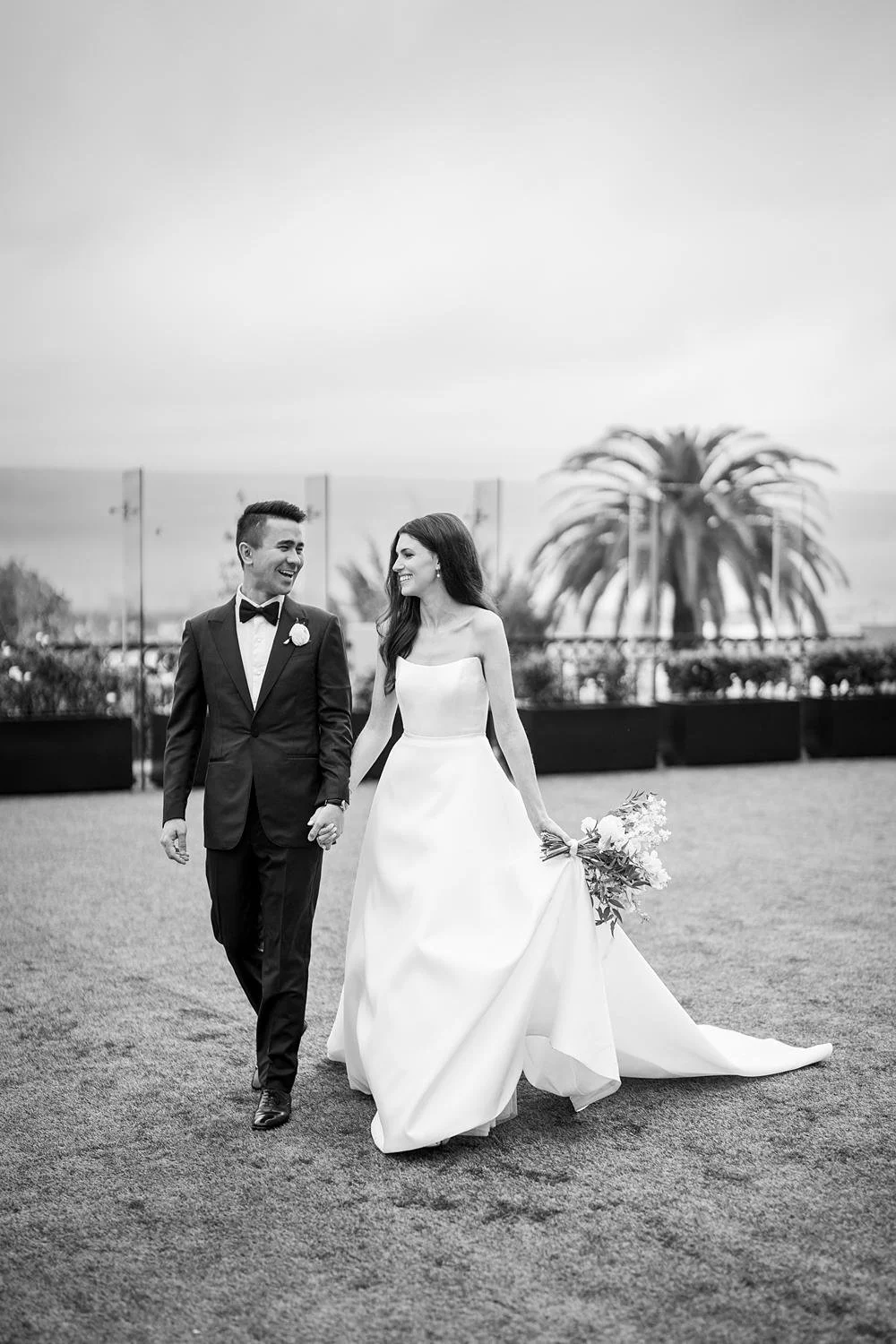 Wedding portrait at the London West Hollywood with the couple walking through Hampton Court