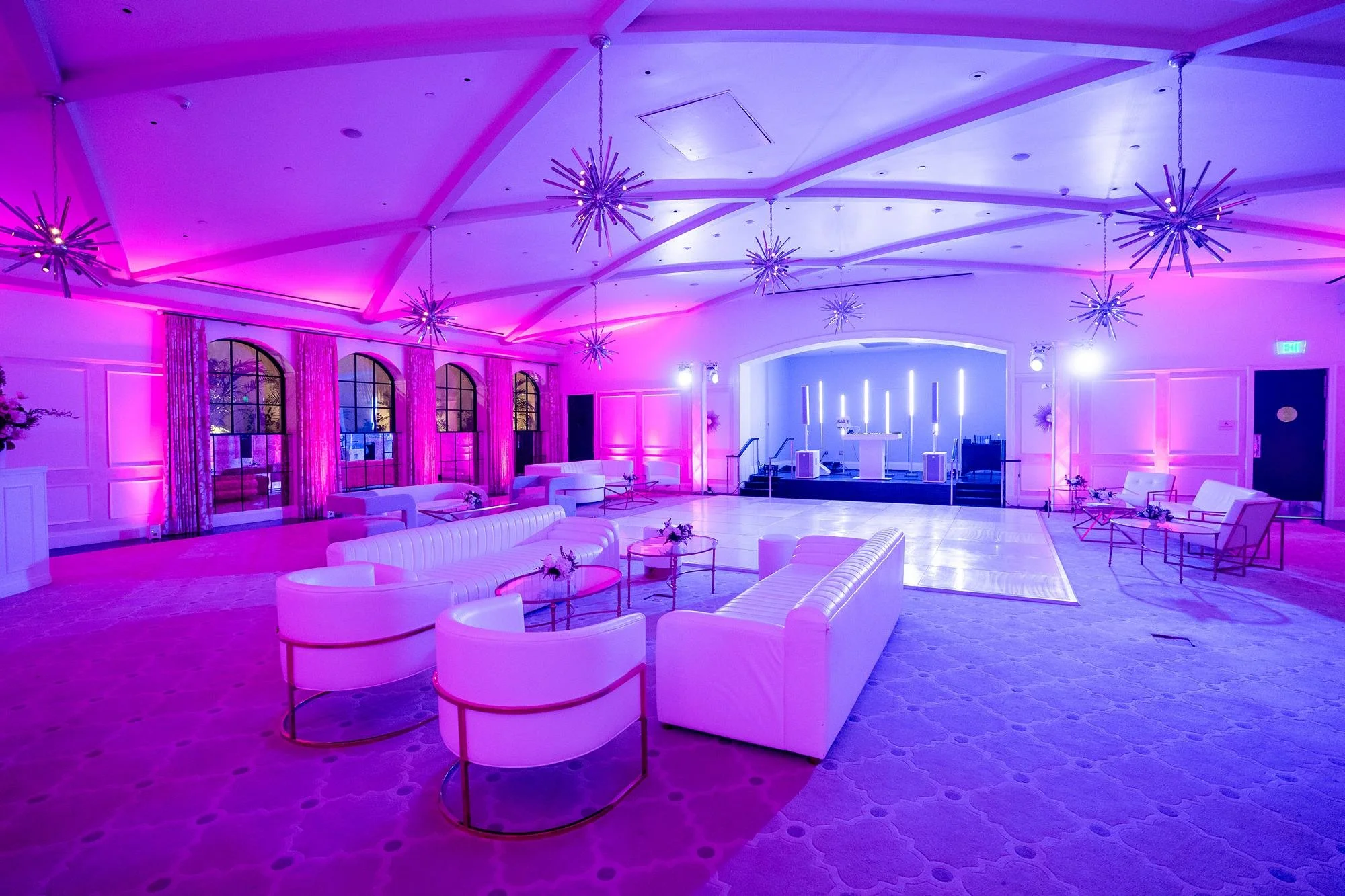 Wedding reception after party in the Garden Ballroom at Hotel Bel Air with lounge seating and pink lighting