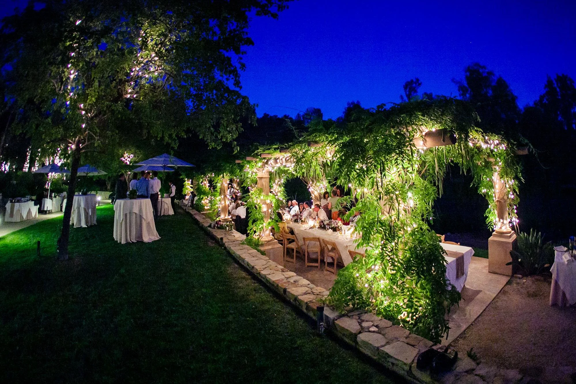 Wedding reception in the Herb Garden at Ojai Valley Inn and Spa with guests dining at long tables