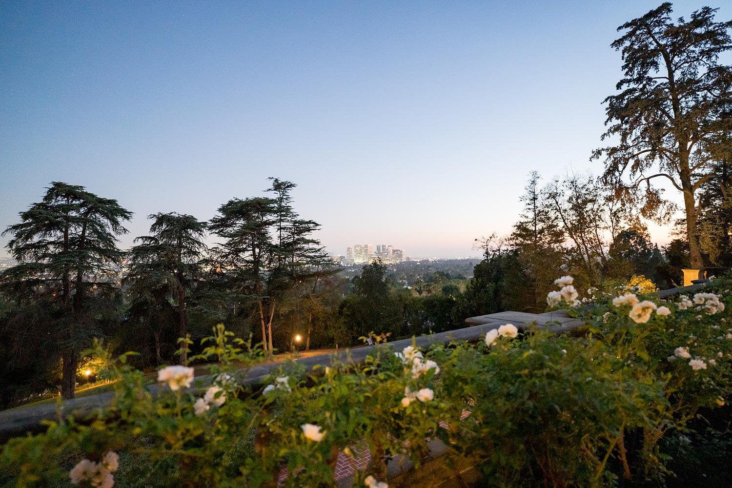 Wedding reception with view from the Mansion Terrace at Greystone Mansion overlooking downtown Los Angeles at dusk