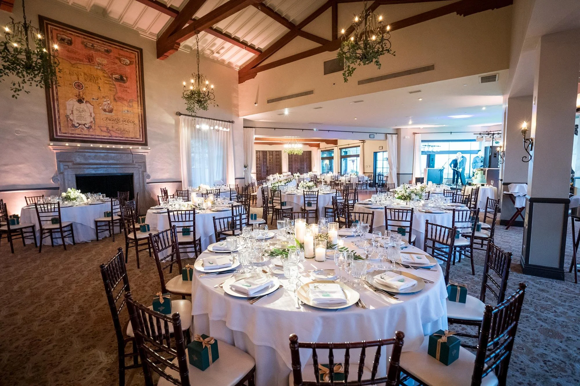 Dining Room wedding reception tables with candles and floral centerpieces at Bel Air Bay Club