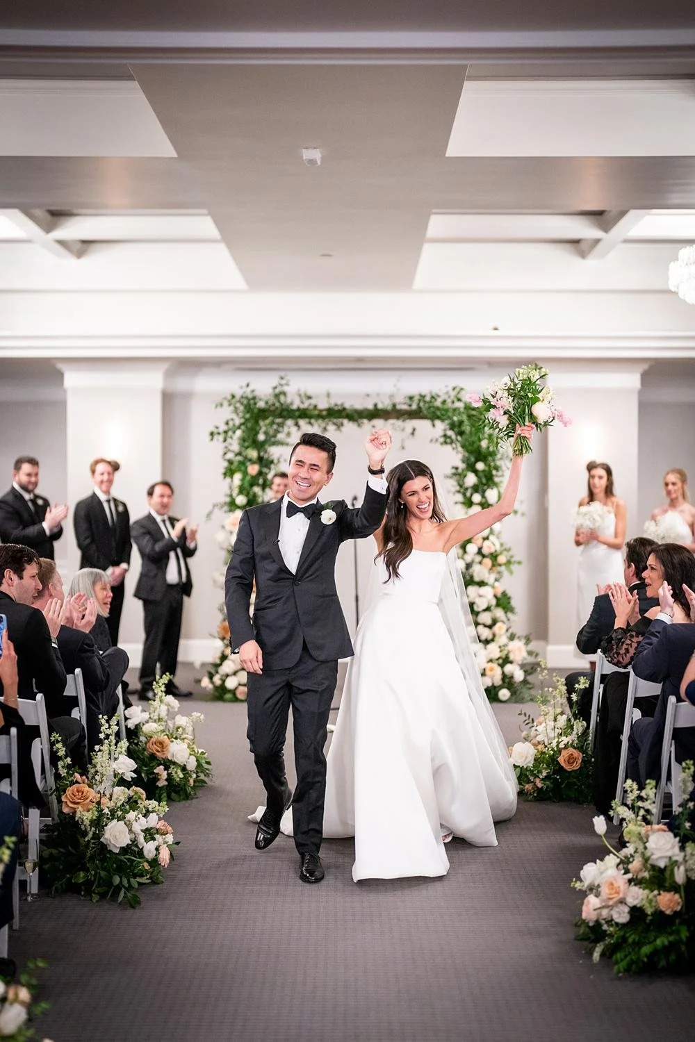 Wedding ceremony in Kensington Ballroom at the London West Hollywood with the couple celebrating