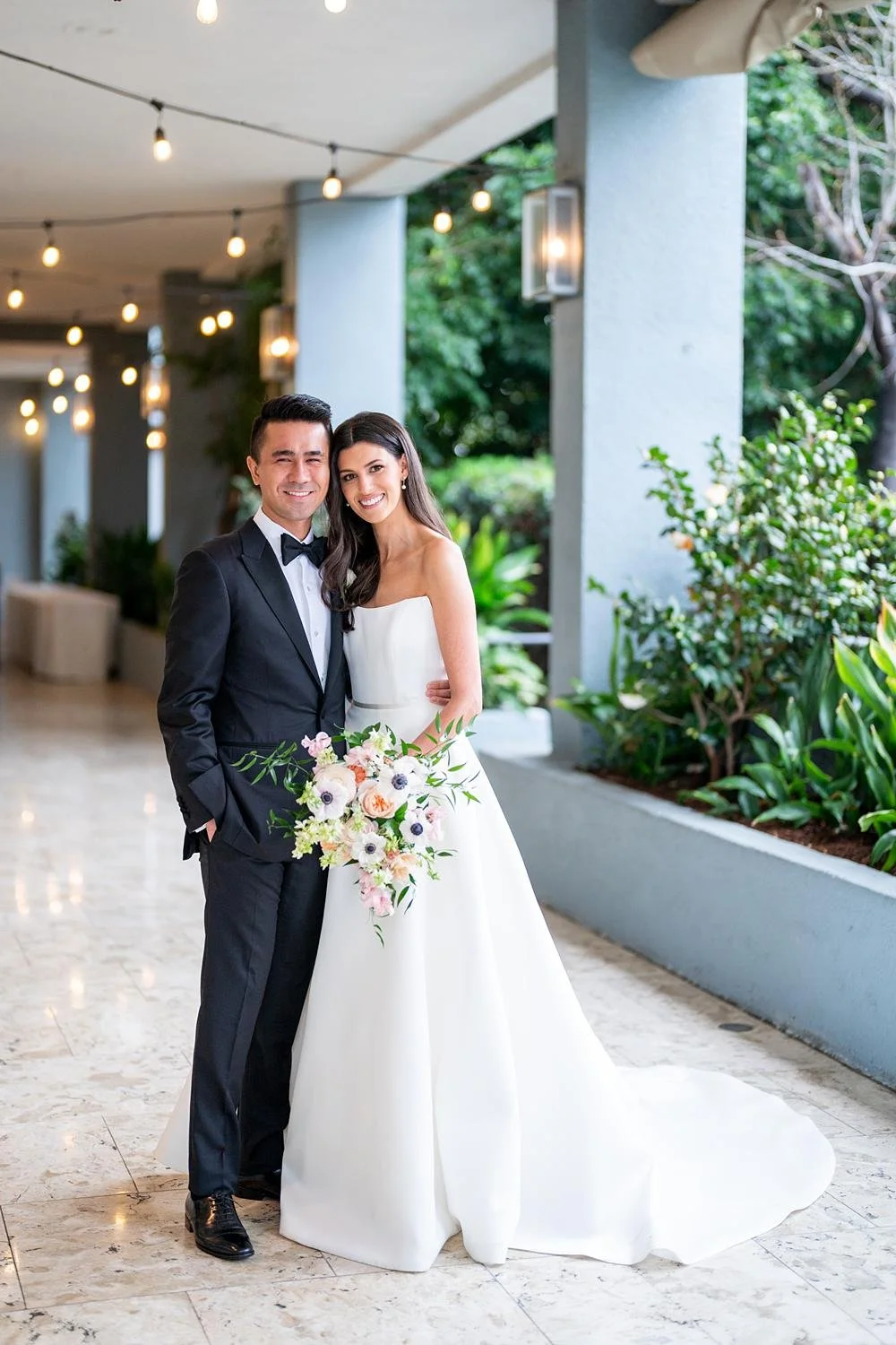 Wedding portrait at the London West Hollywood of bride and groom on a marble walkway