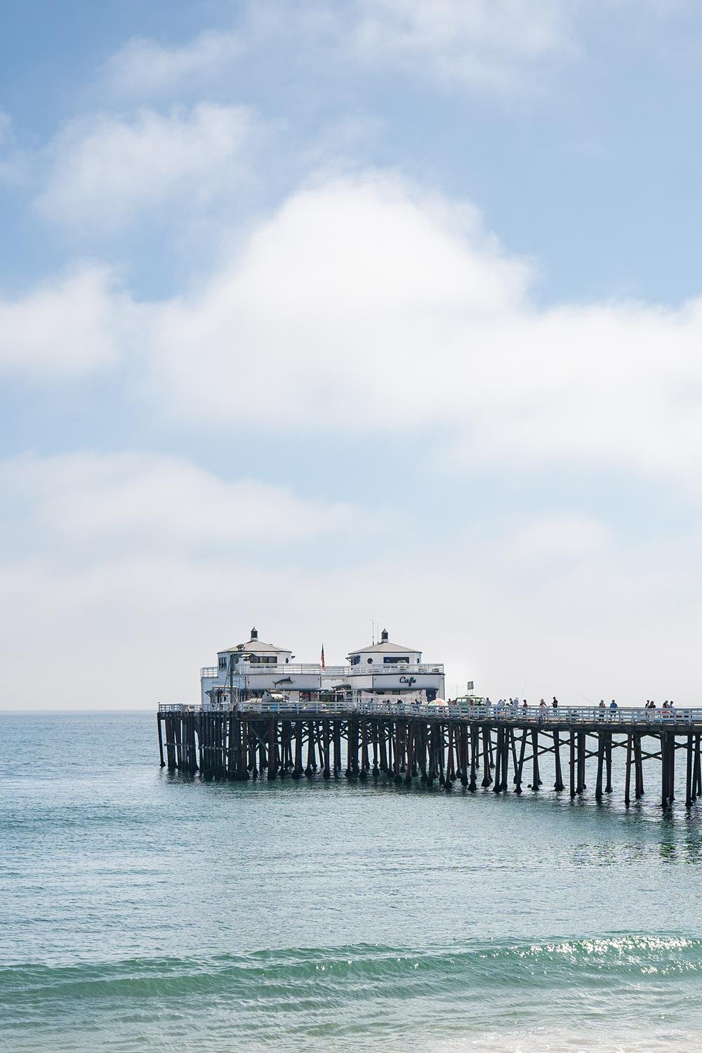 Wedding scenery at Malibu Farm at the Pier showing ocean and pier under a blue sky