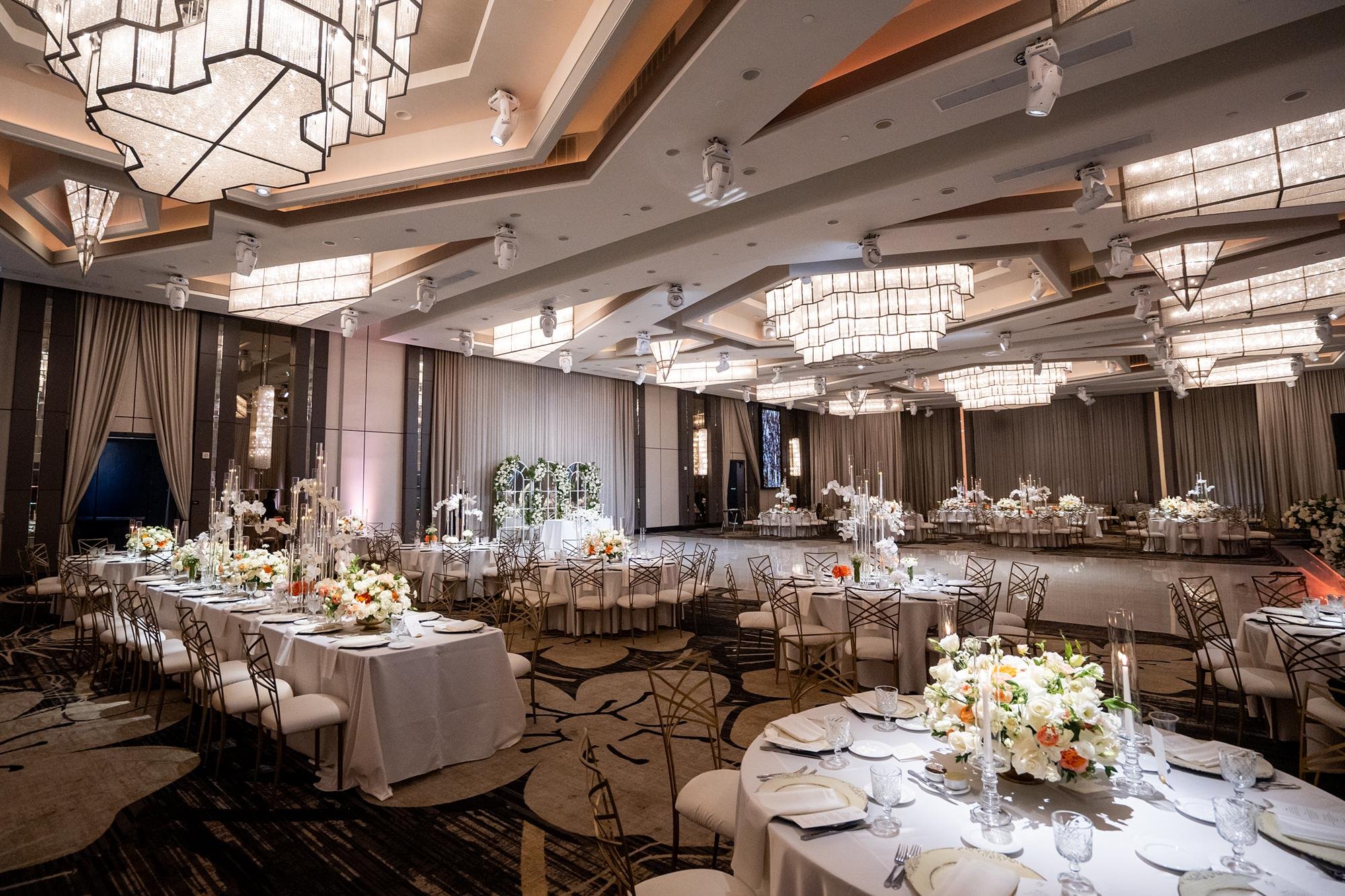 Wedding reception at Landmark Mission Hills with dramatic lighting and floral centerpieces