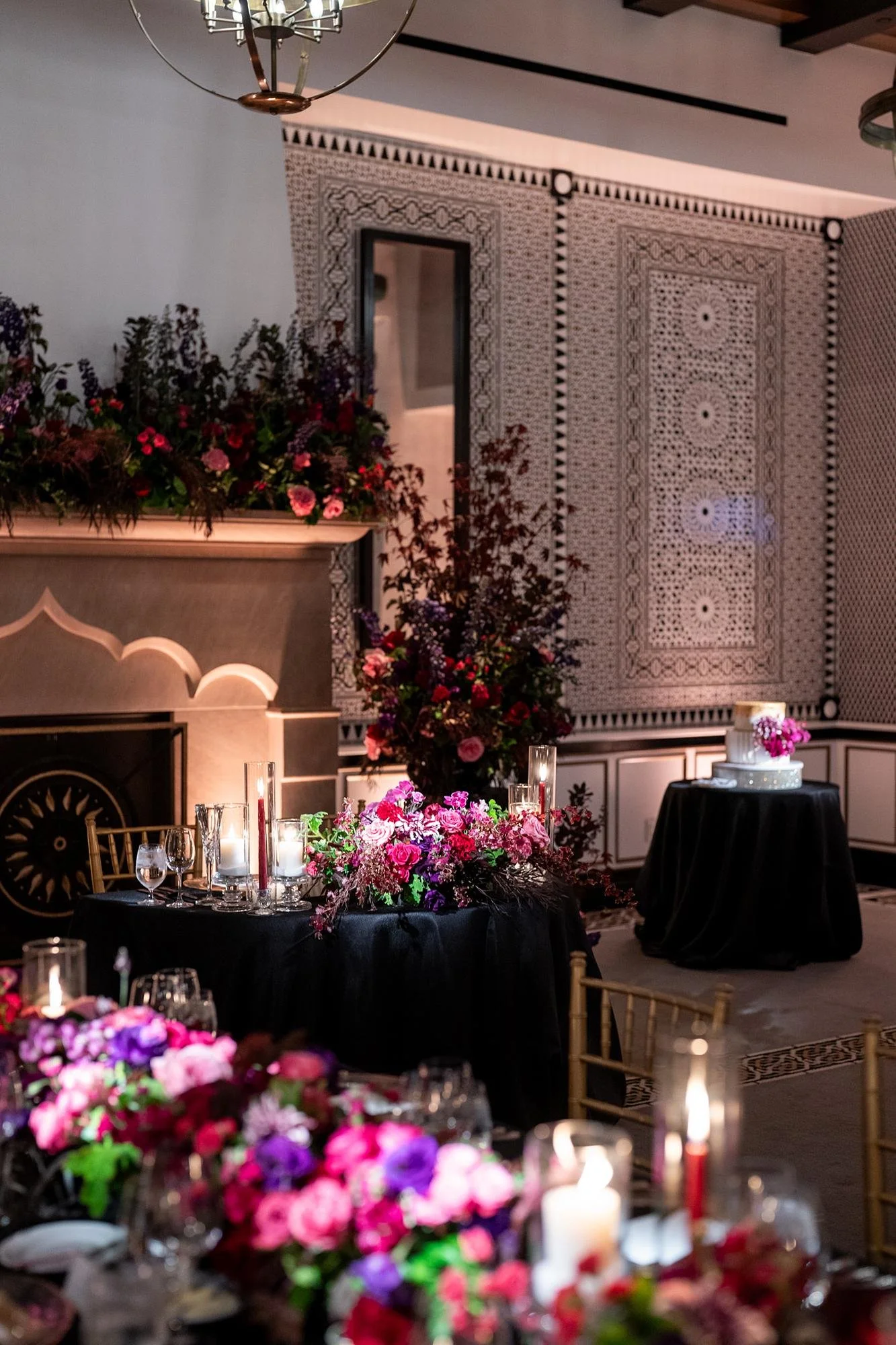 edding reception at Hotel Californian with sweetheart table set before fireplace