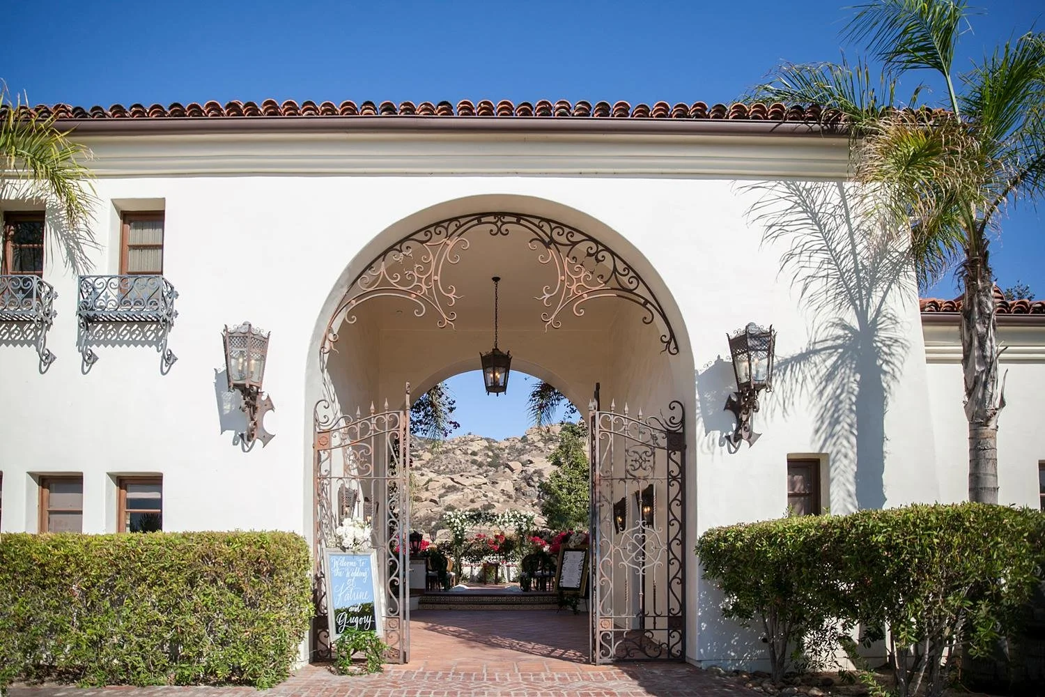 Iron gate entrance leading to the Villa wedding ceremony at Hummingbird Nest Ranch