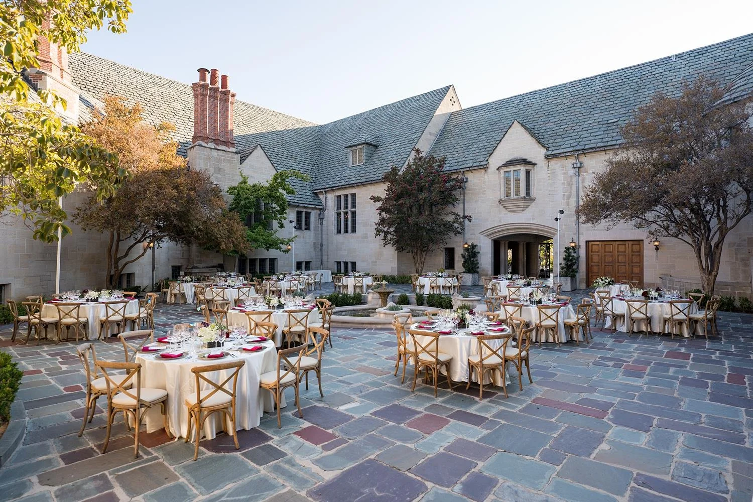 Wedding reception in the Inner Courtyard at Greystone Mansion with tables arranged around the central fountain