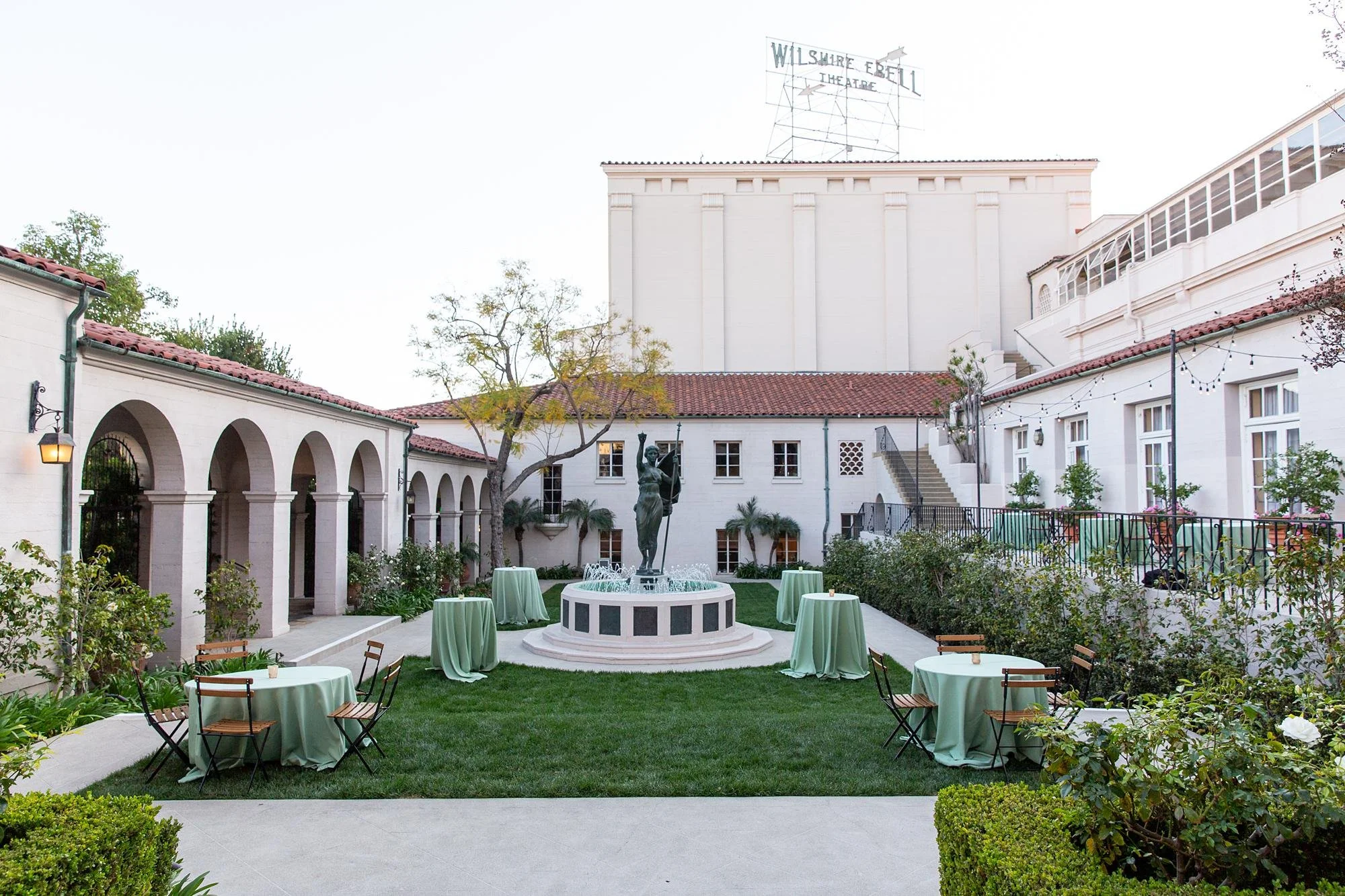 Garden wedding cocktails with fountain and historic building sign at Ebell of Los Angeles 7.