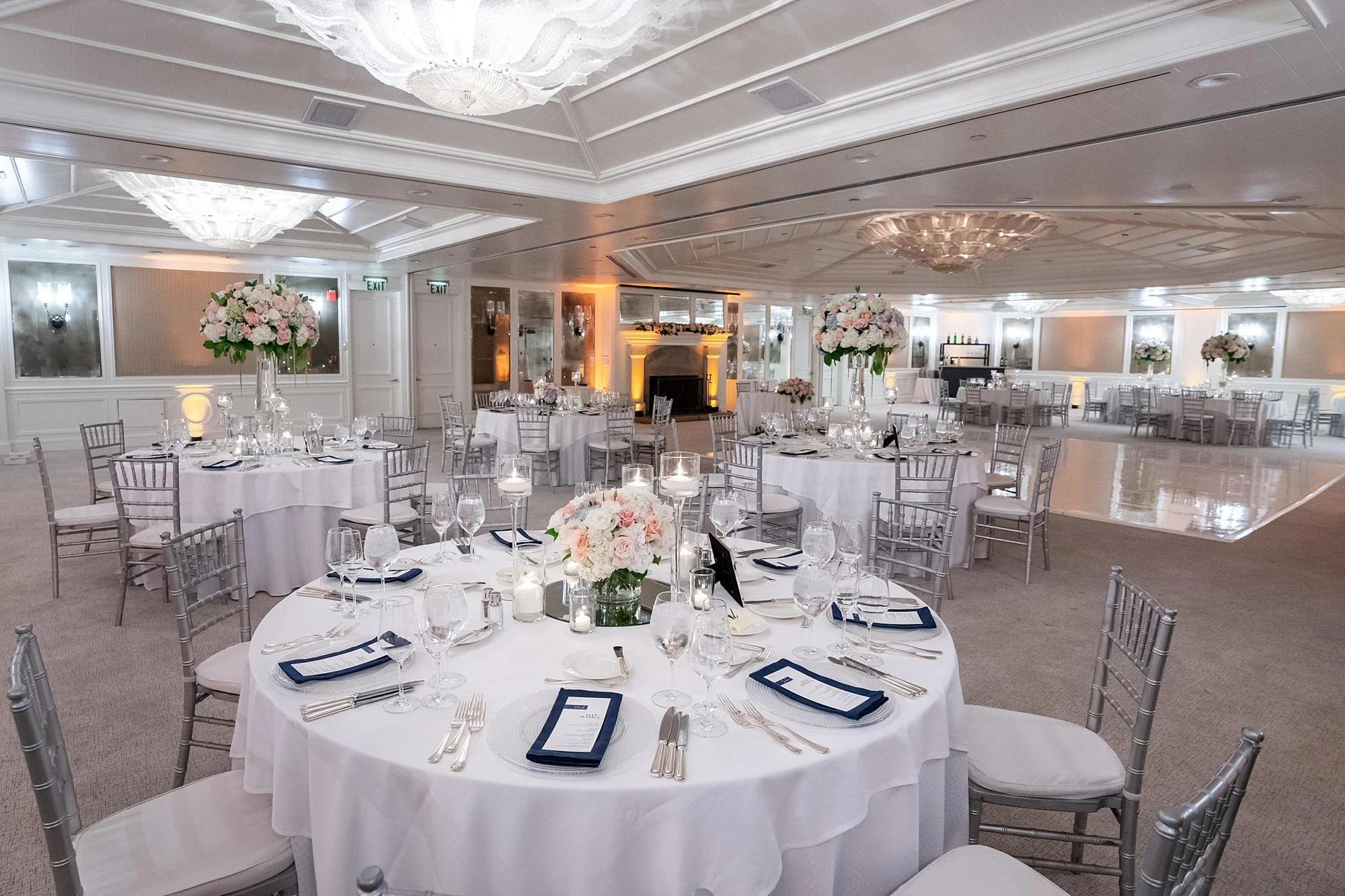 ShutWedding reception in the Grand Salon at Shutters on the Beach featuring rose and candle centerpiecesters on the Beach Wedding Venue | Miki & Sonja Photography | www.mikiandsonja.com