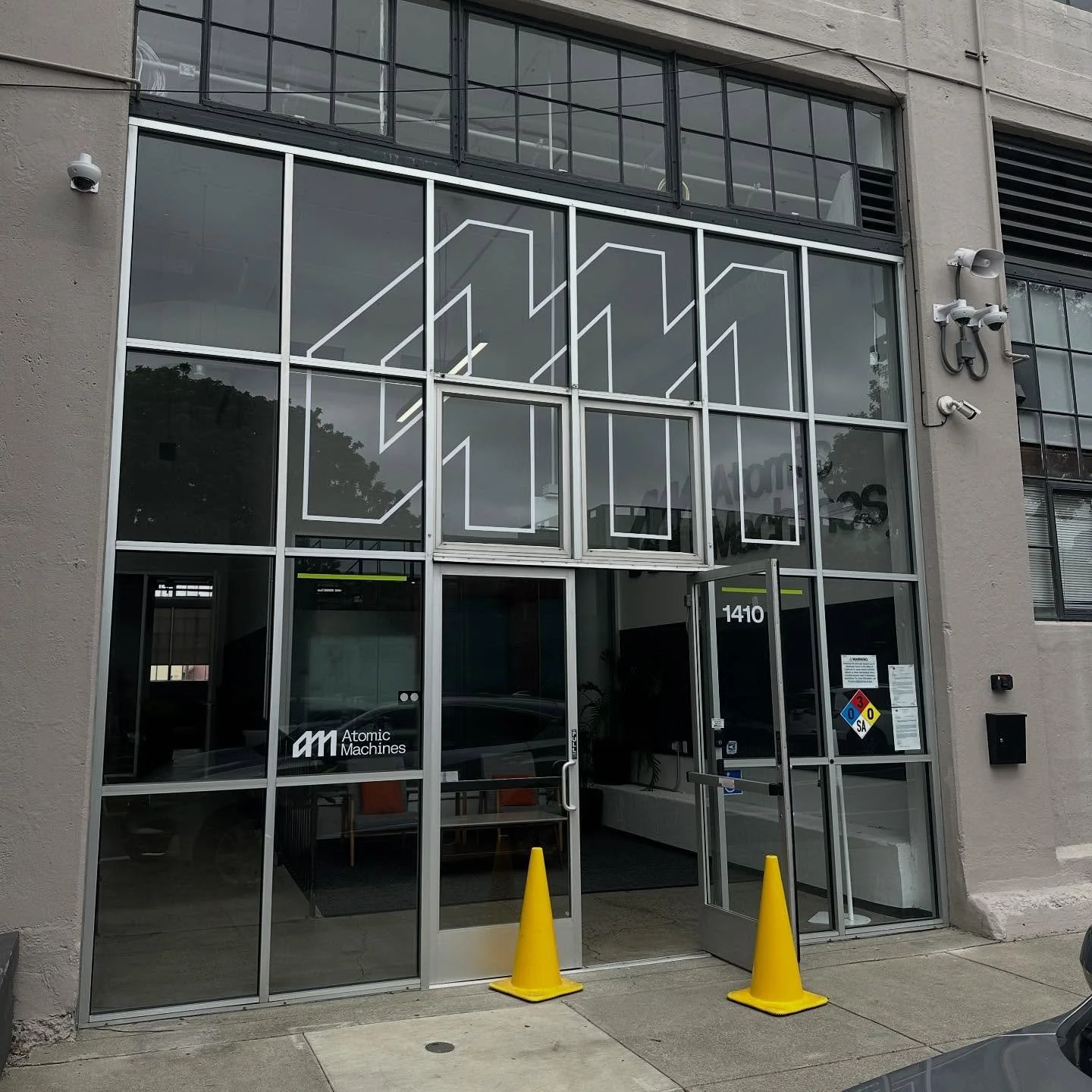 Executed a branding concept at Atomic Machines&rsquo; new space in Emeryville today. Window graphics, dimensional logo, and a dibond sign for their loading dock ✅