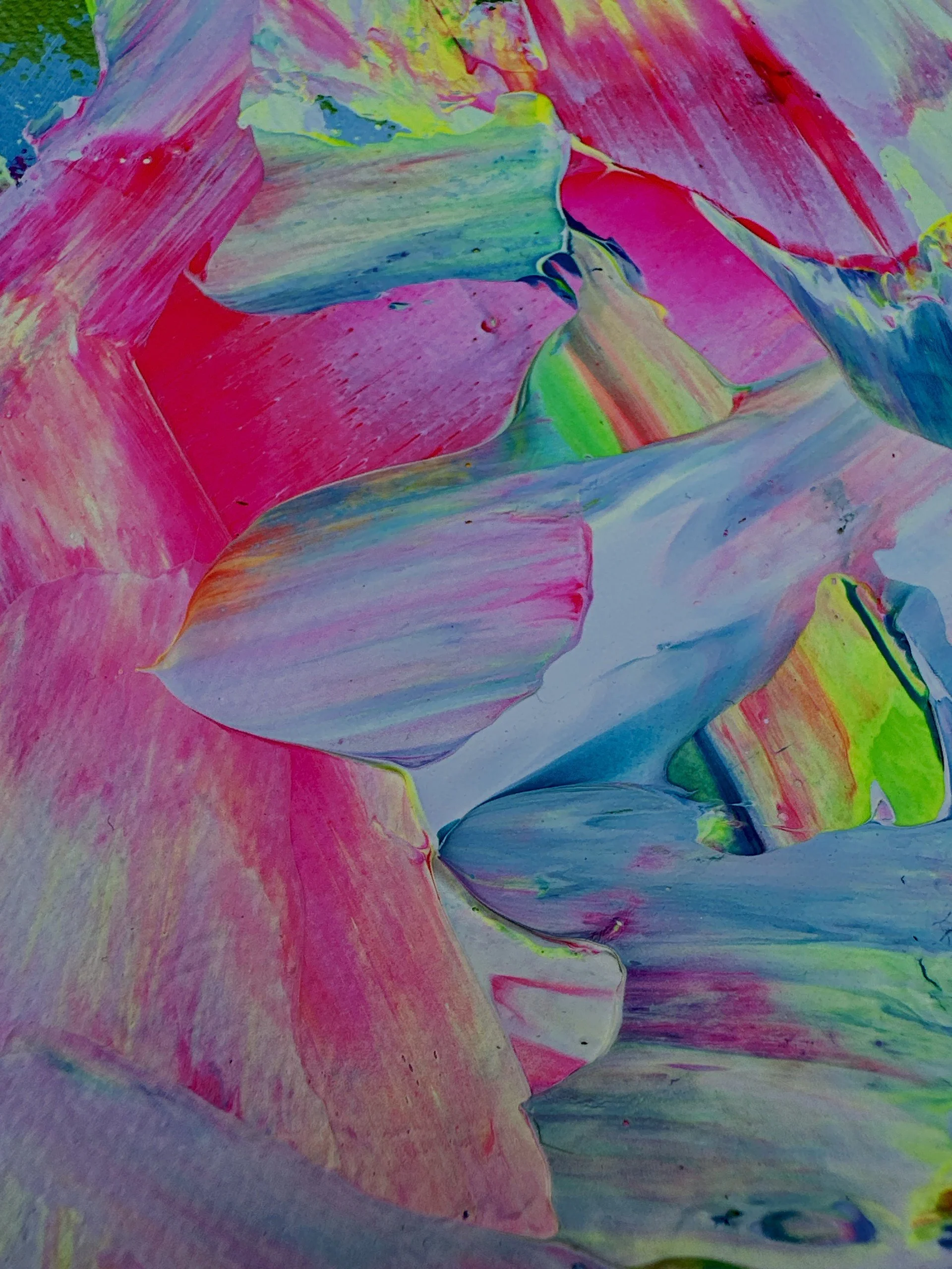 Close-up of colorful abstract paint strokes with pink, blue, green, and yellow hues.