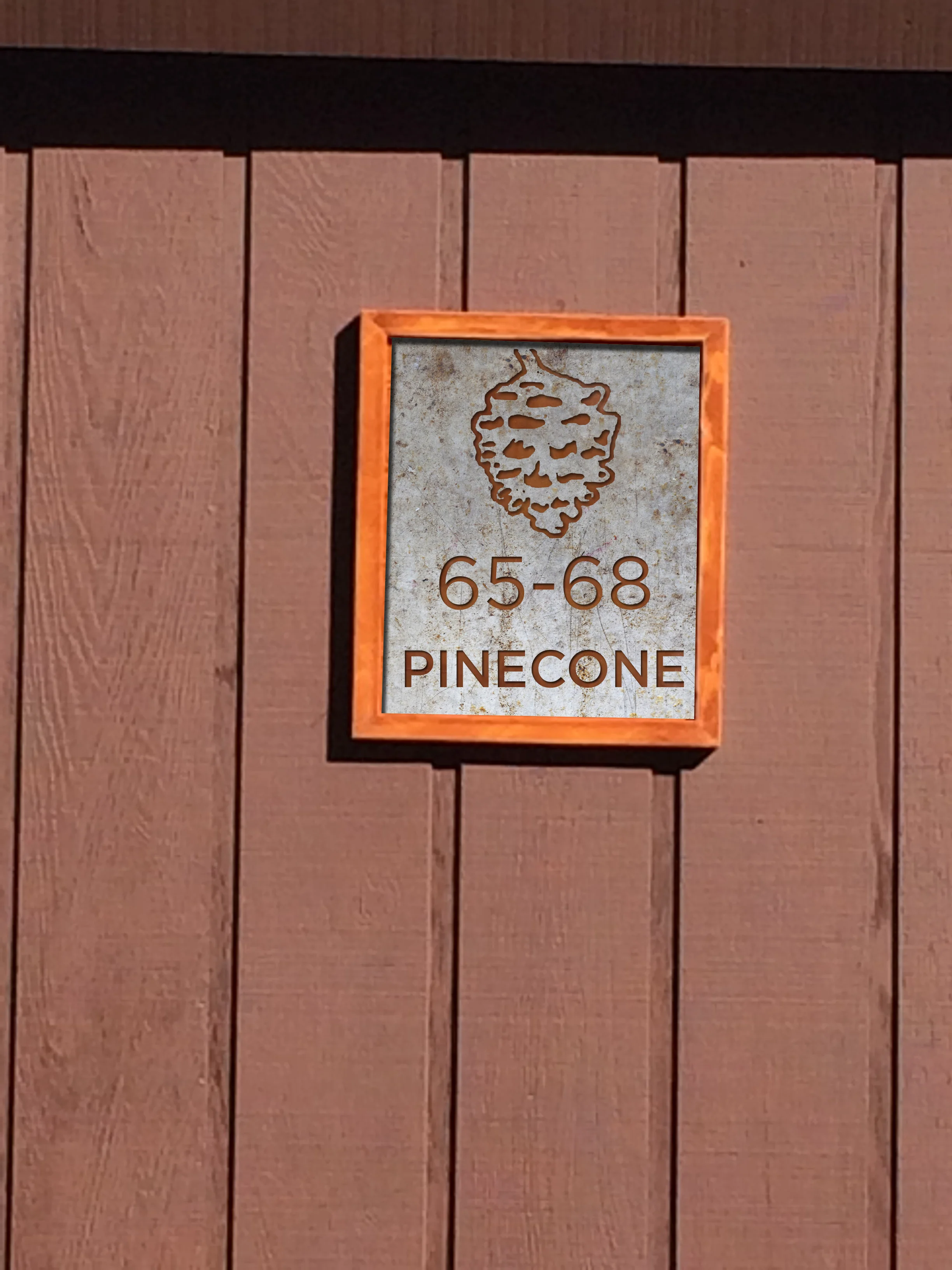 IMG_2893_bldg_sign_pinecone_row.jpg