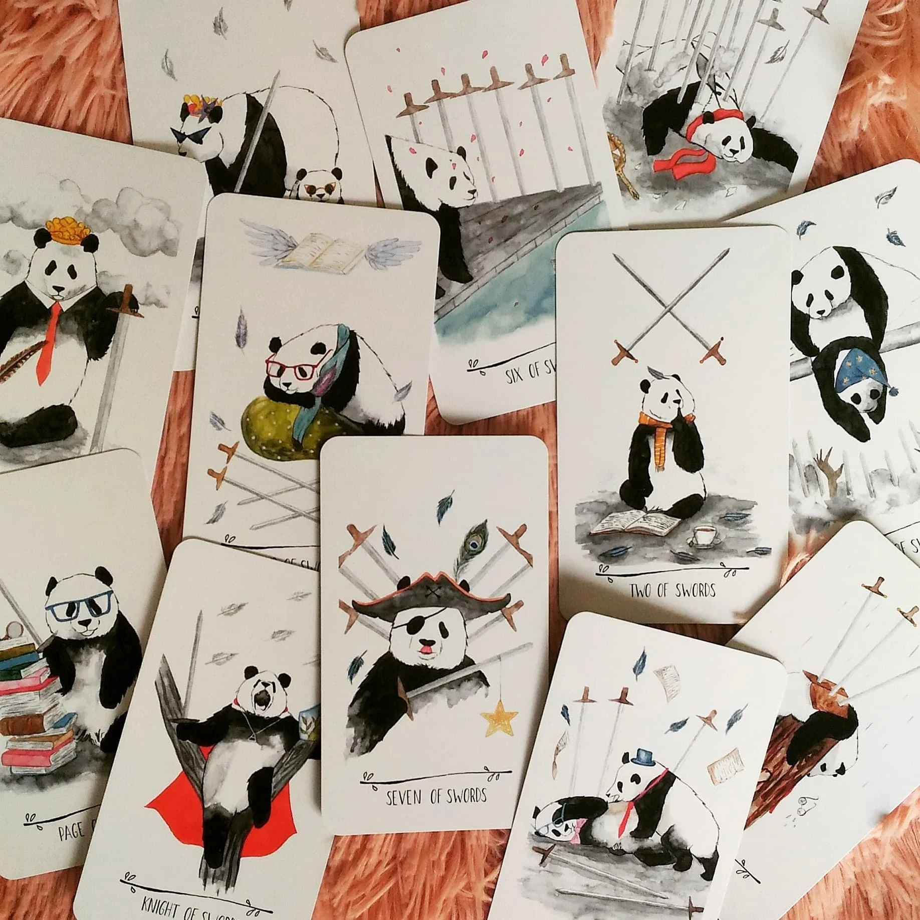 The Suit of Swords…speaking of “arguments”, you can see the 5 of Swords panda really going at it.