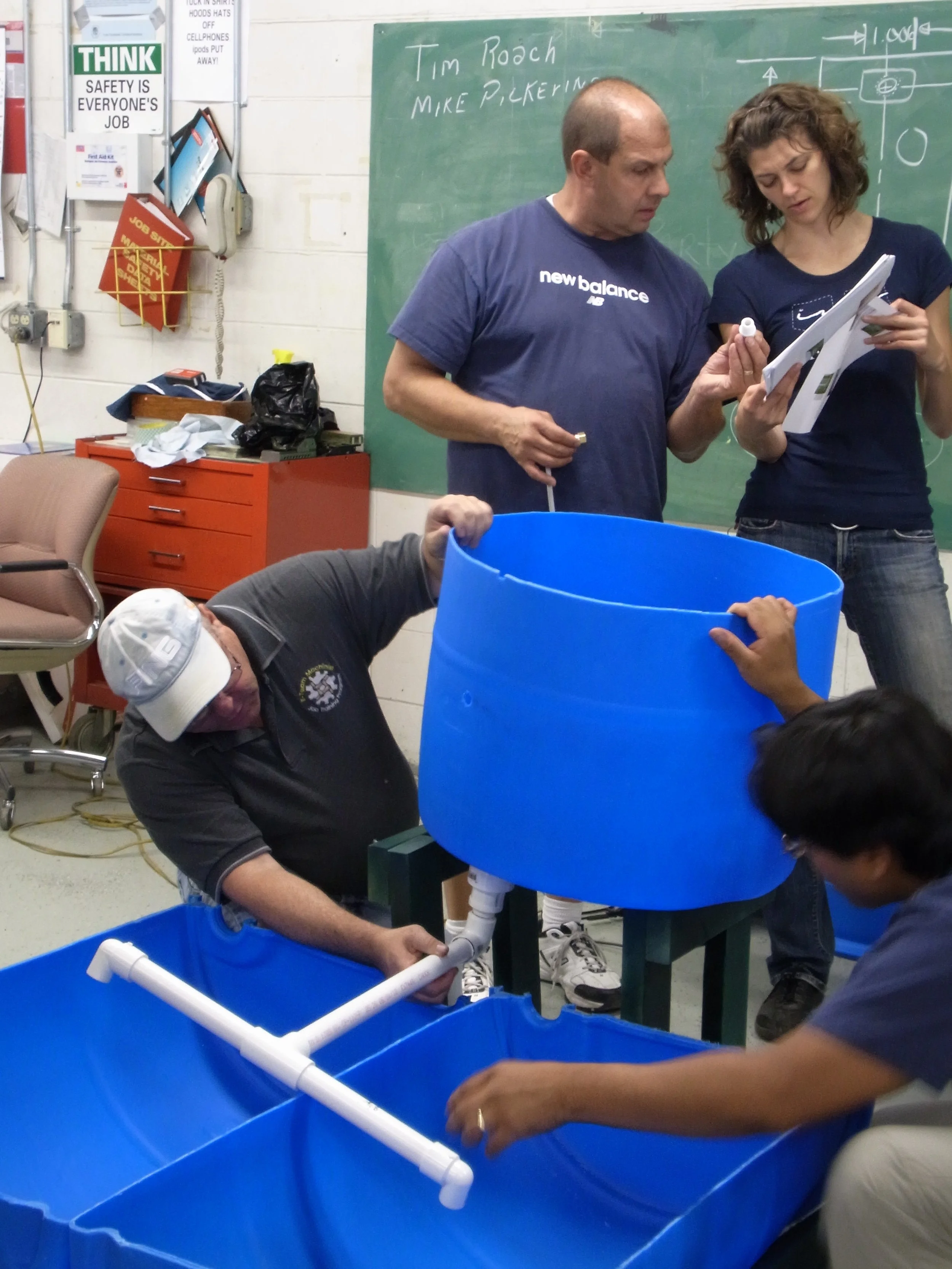 Consulting the Plans and Discussing Next Steps for Construction